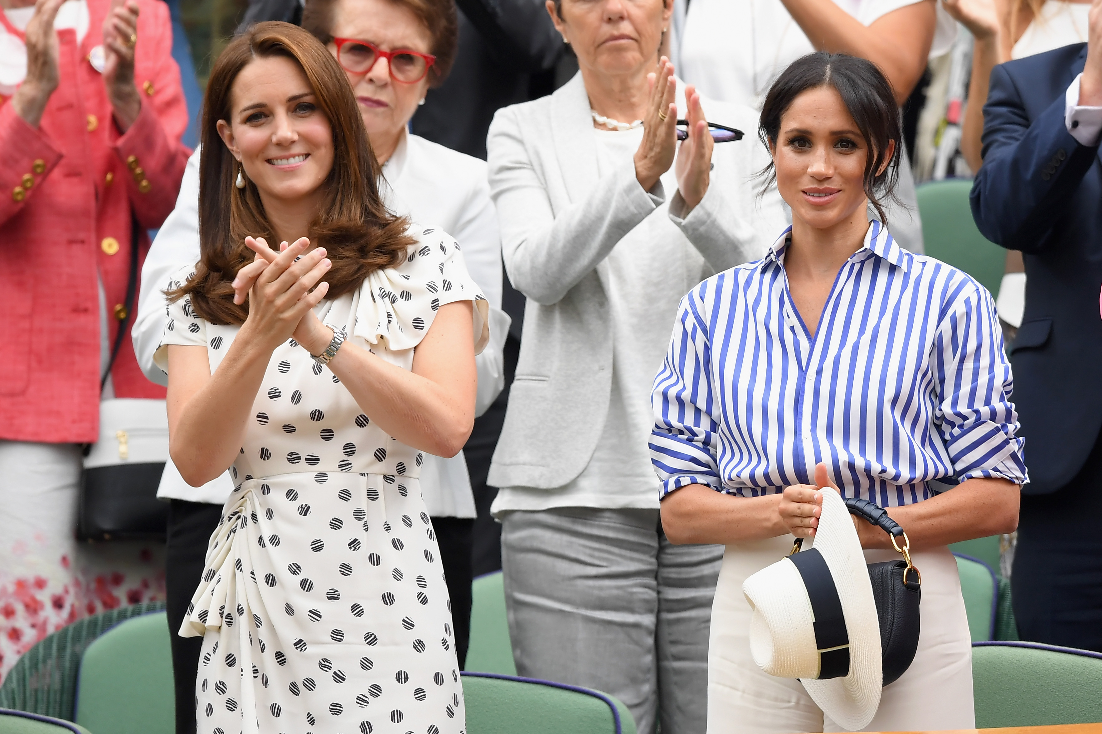 Catherine, Princess of Wales, and Meghan, Duchess of Sussex, on day 12 of the Wimbledon Championships at the All England Lawn Tennis and Croquet Club on July 14, 2018, in London. | Source: Getty Images