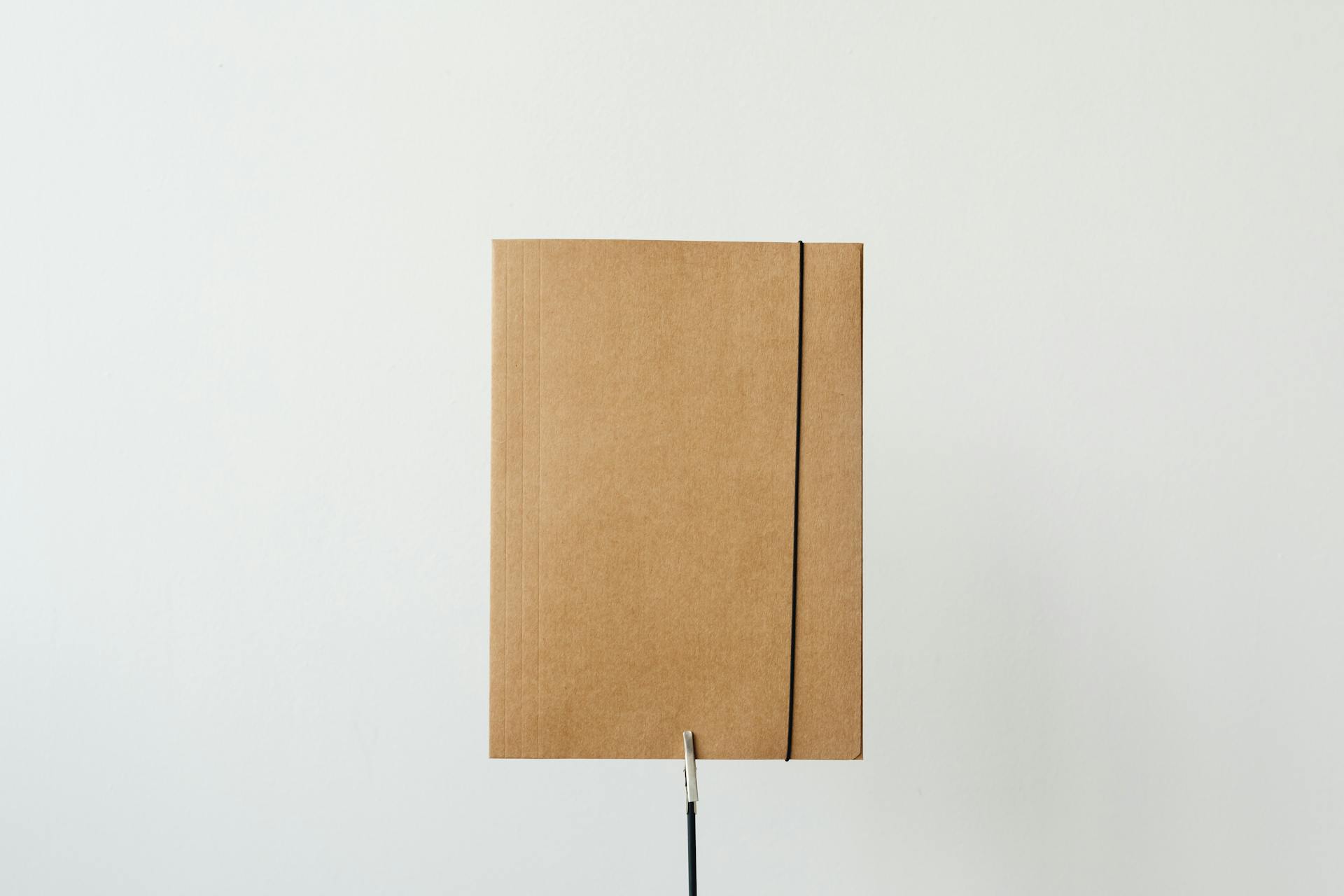 A folder on a table | Source: Pexels
