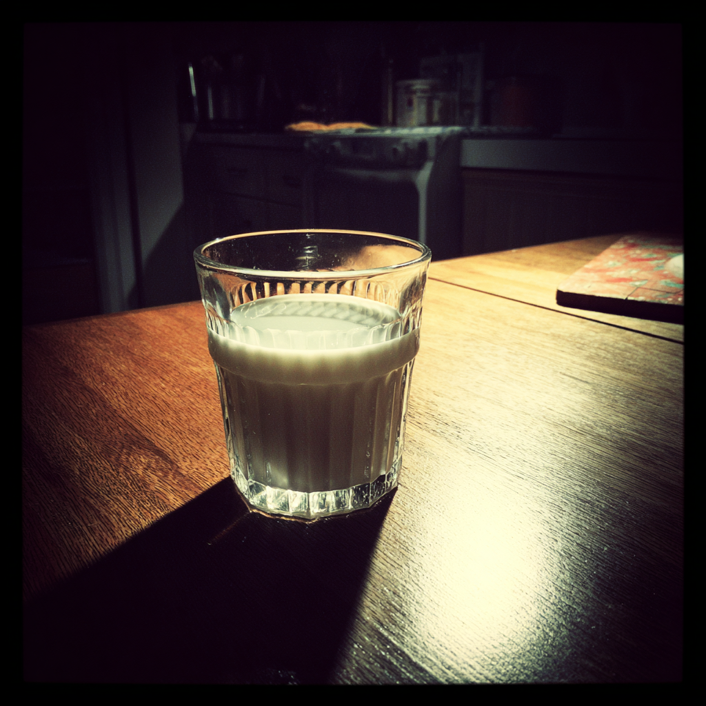 A glass of milk on a table | Source: no source