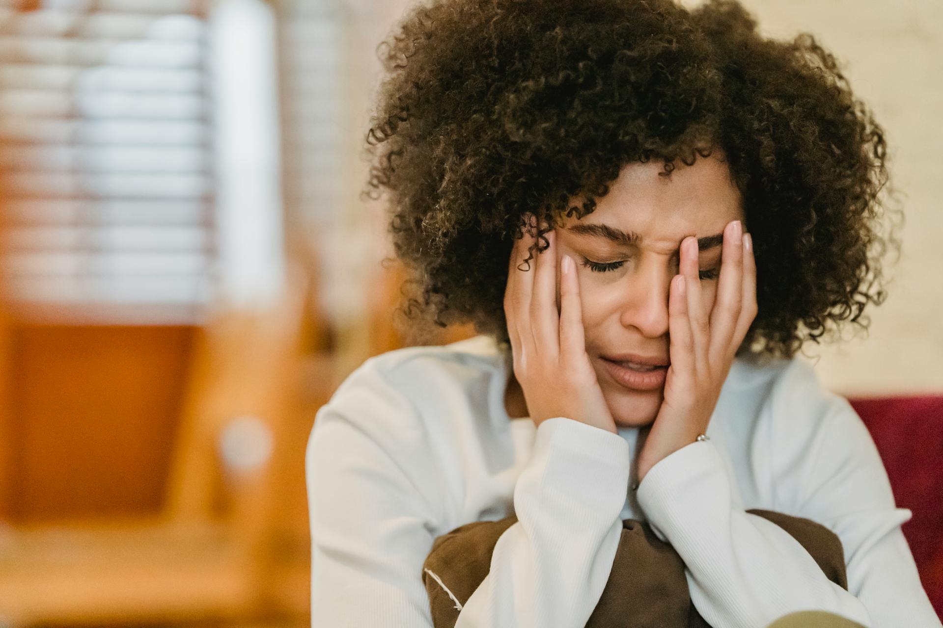 A woman crying while talking | Source: no source