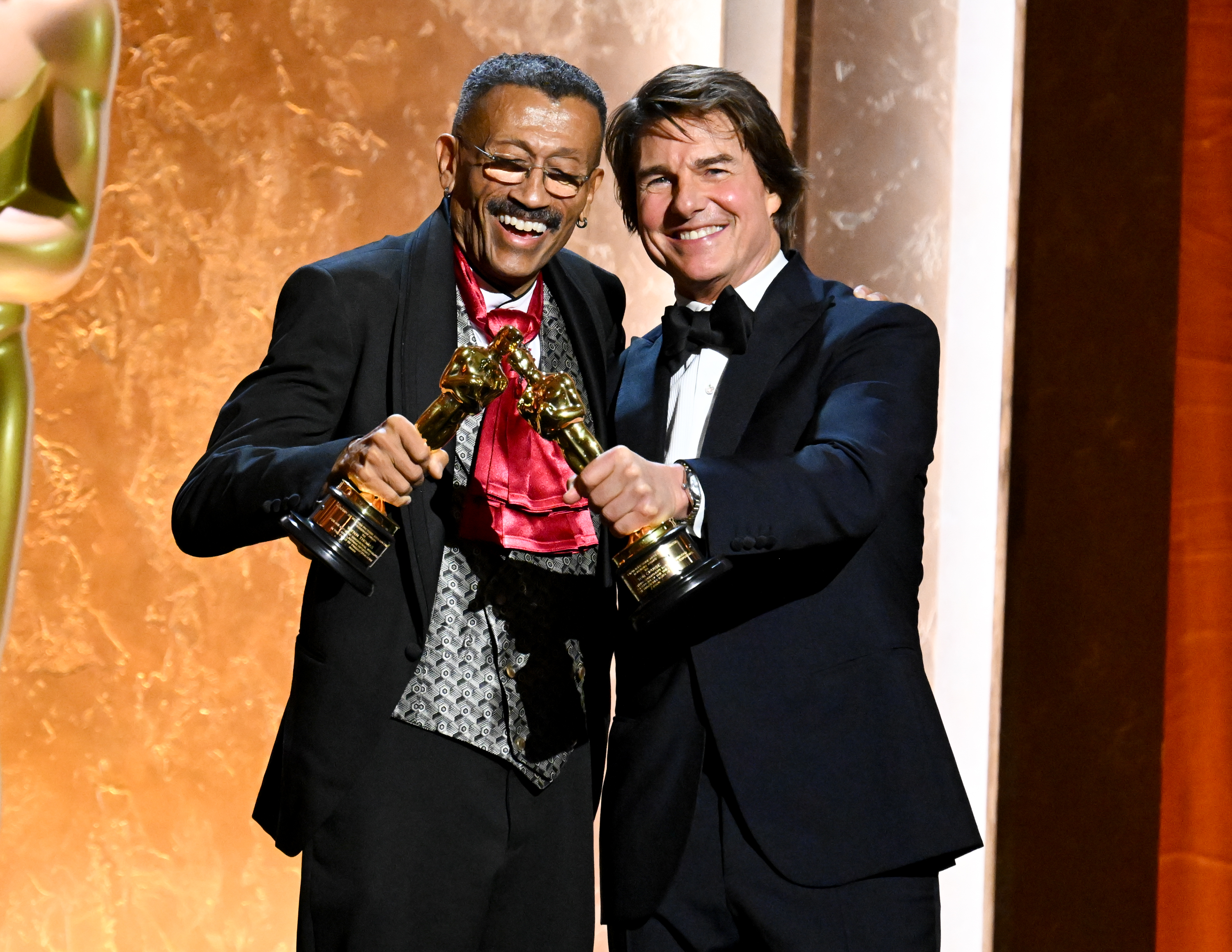 Wynn Thomas and Tom Cruise at the 16th Governors Awards on November 16, 2025, in Los Angeles, California | Source: Getty Images