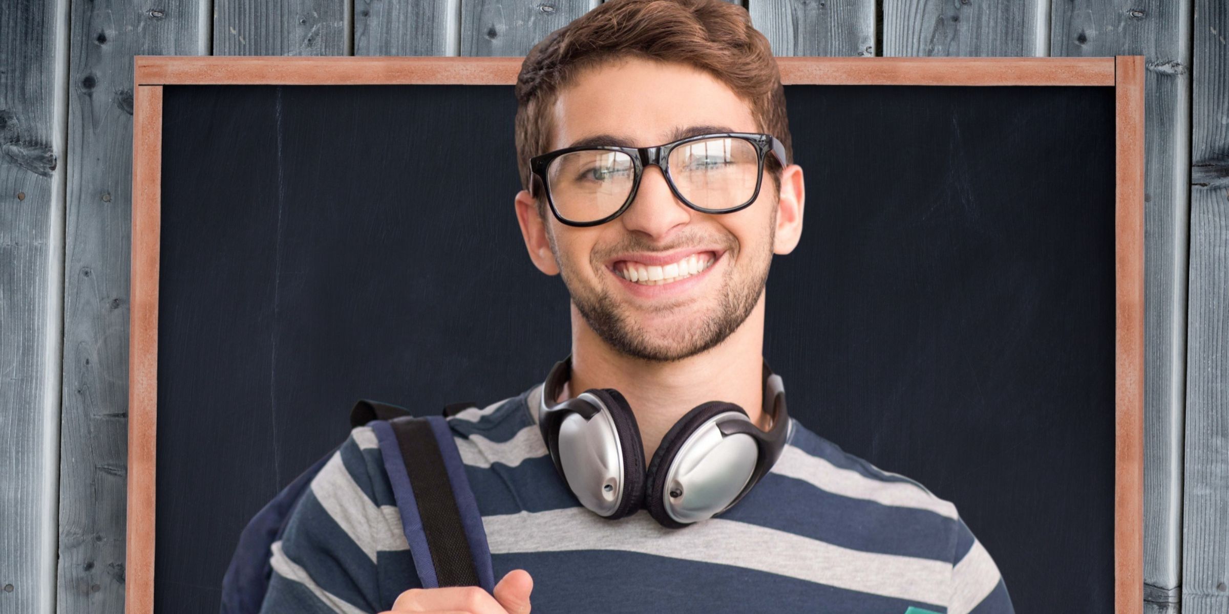 A young man wearing glasses | Source: No source