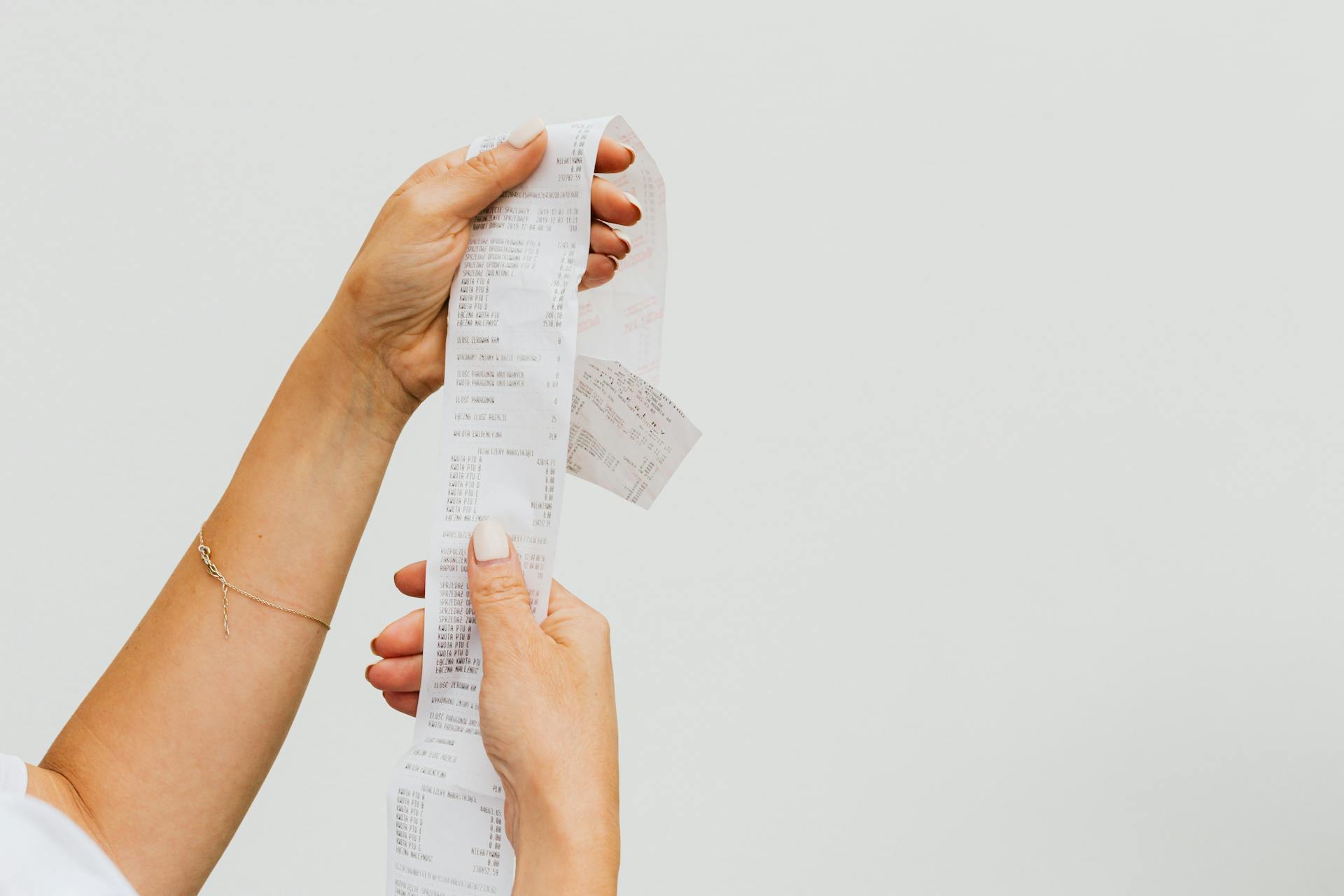 A woman reading a receipt | Source: Pexels