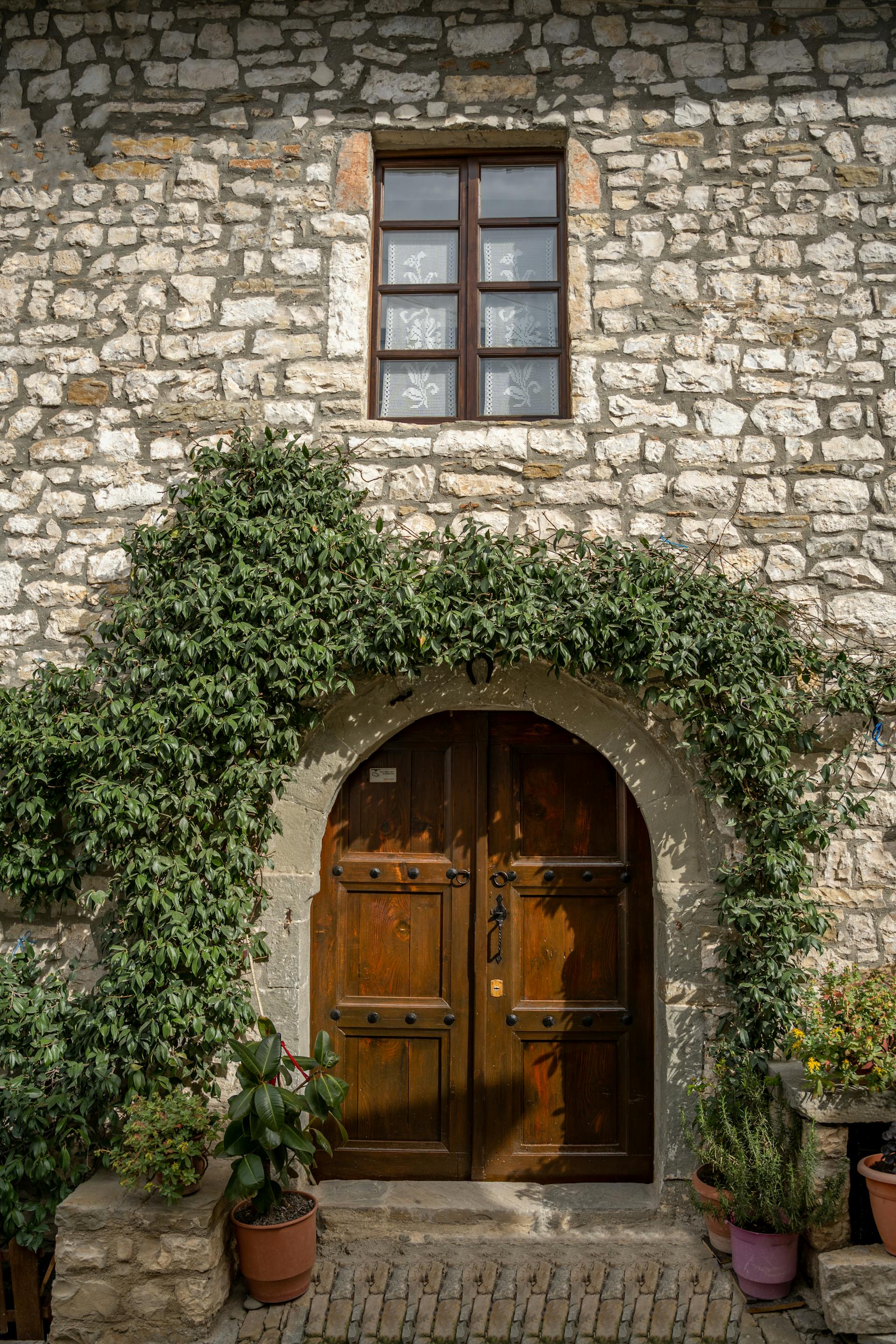 A charming stone building with wooden double doors | Source: Pexels