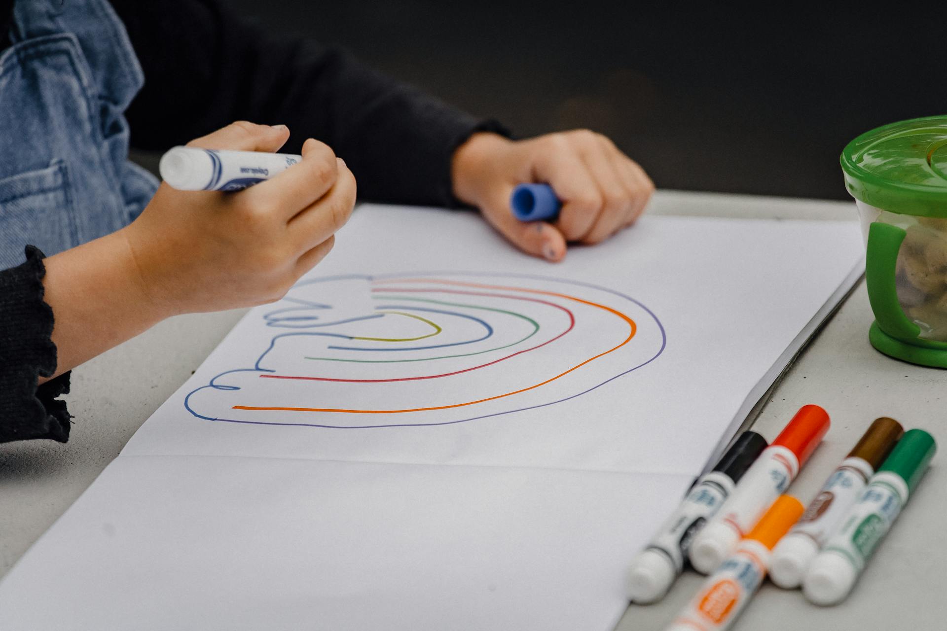 A child coloring a rainbow | Source: Pexels