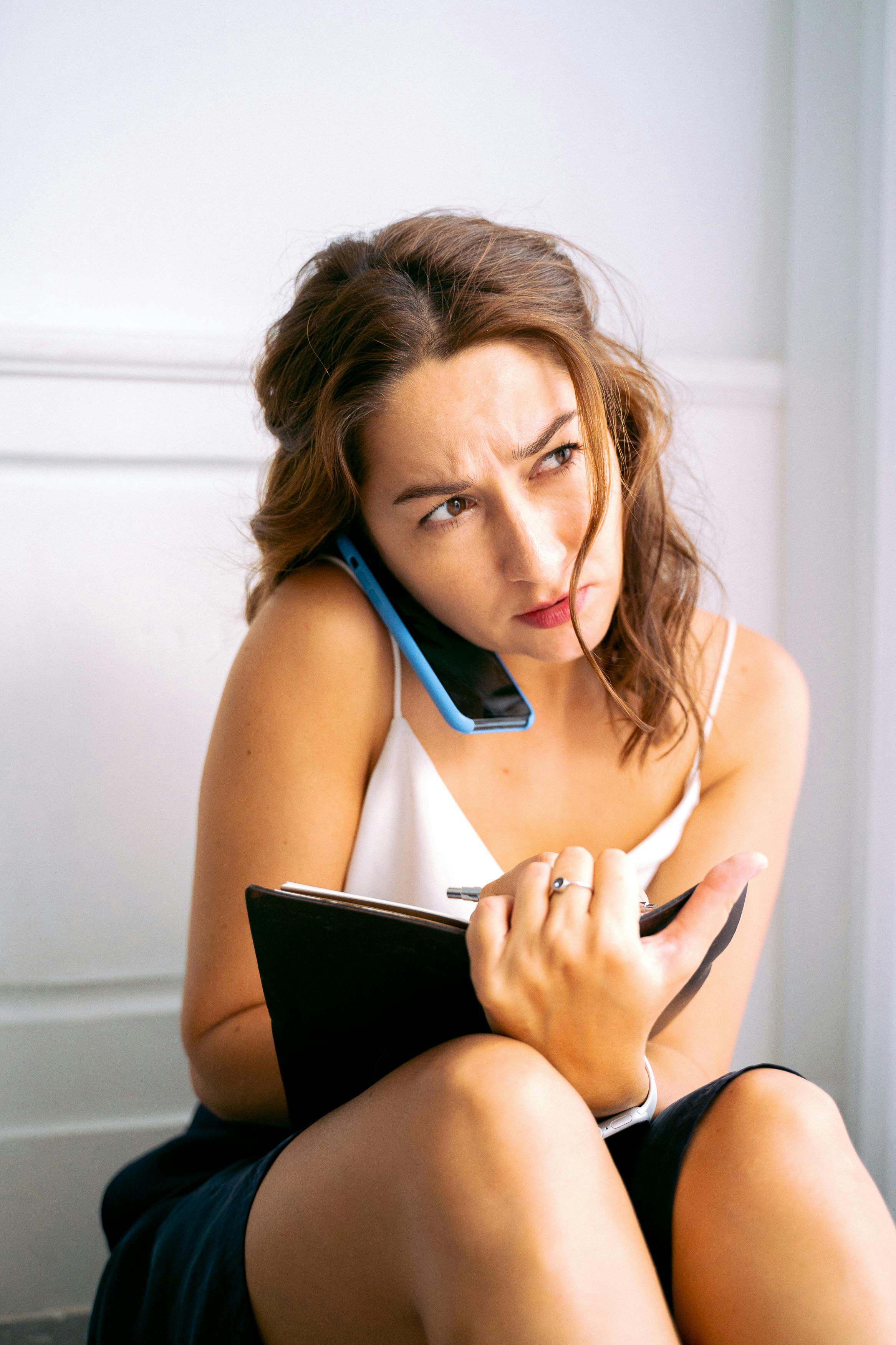 A confused woman on a call | Source: Pexels