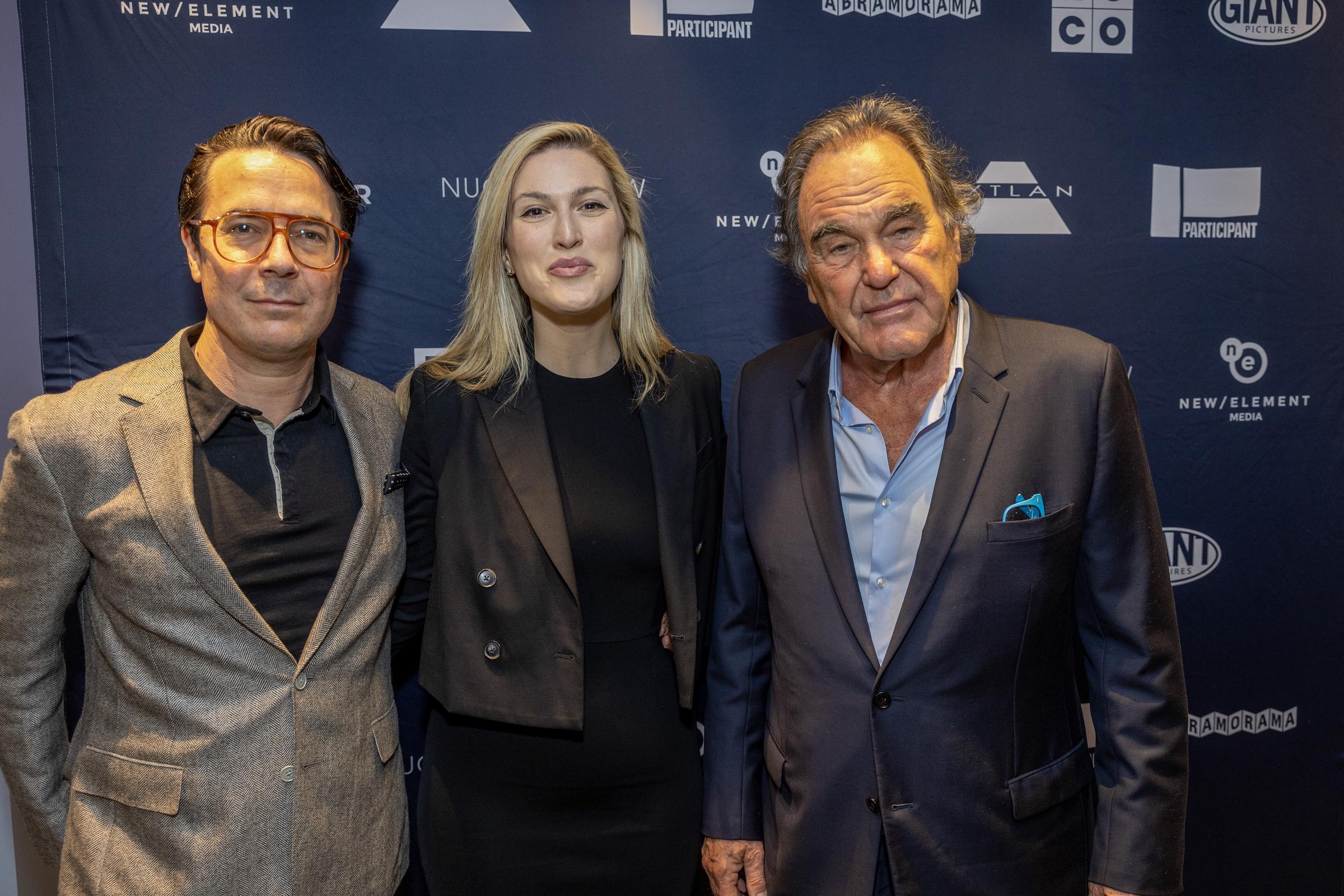 Ryan Lizza, Olivia Nuzzi, and Oliver Stone attends the screening of "Nuclear Now" on May 1, 2023 | Source: Getty Images
