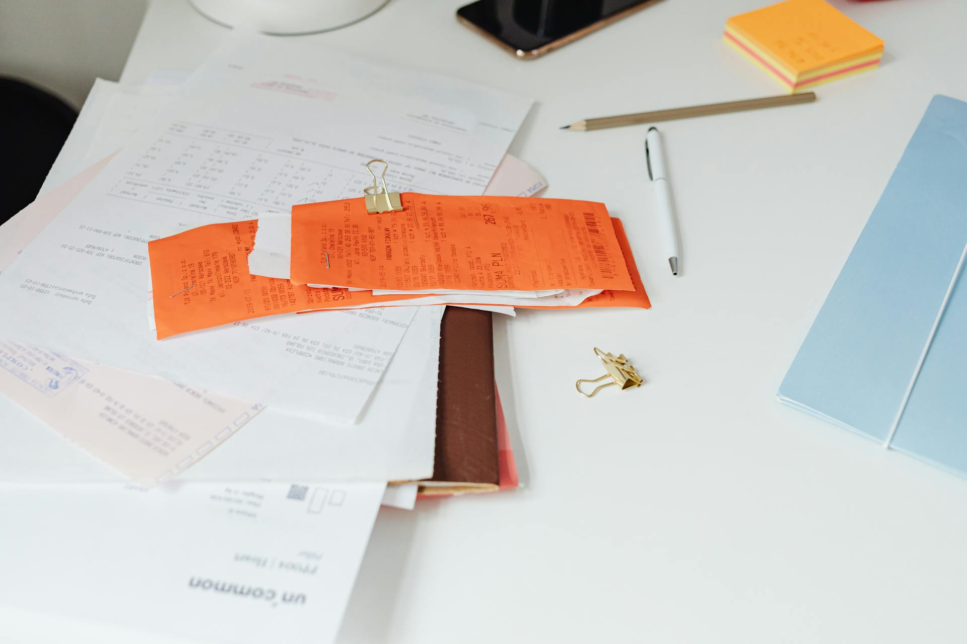 Receipts and documents on a desk | Source: Pexels