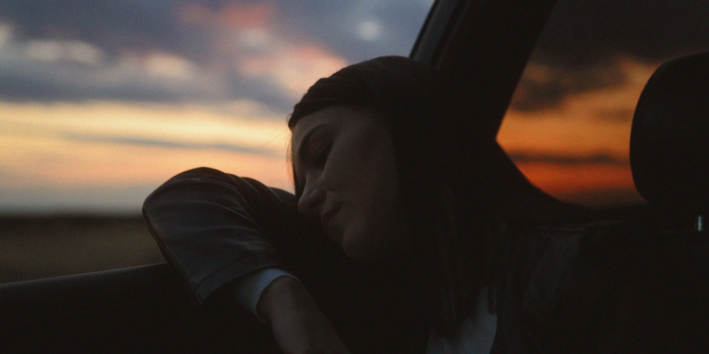 A woman fast asleep in a car | Source: Pexels