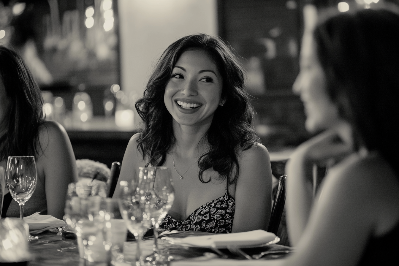Women seated at a dinner table | Source: No source