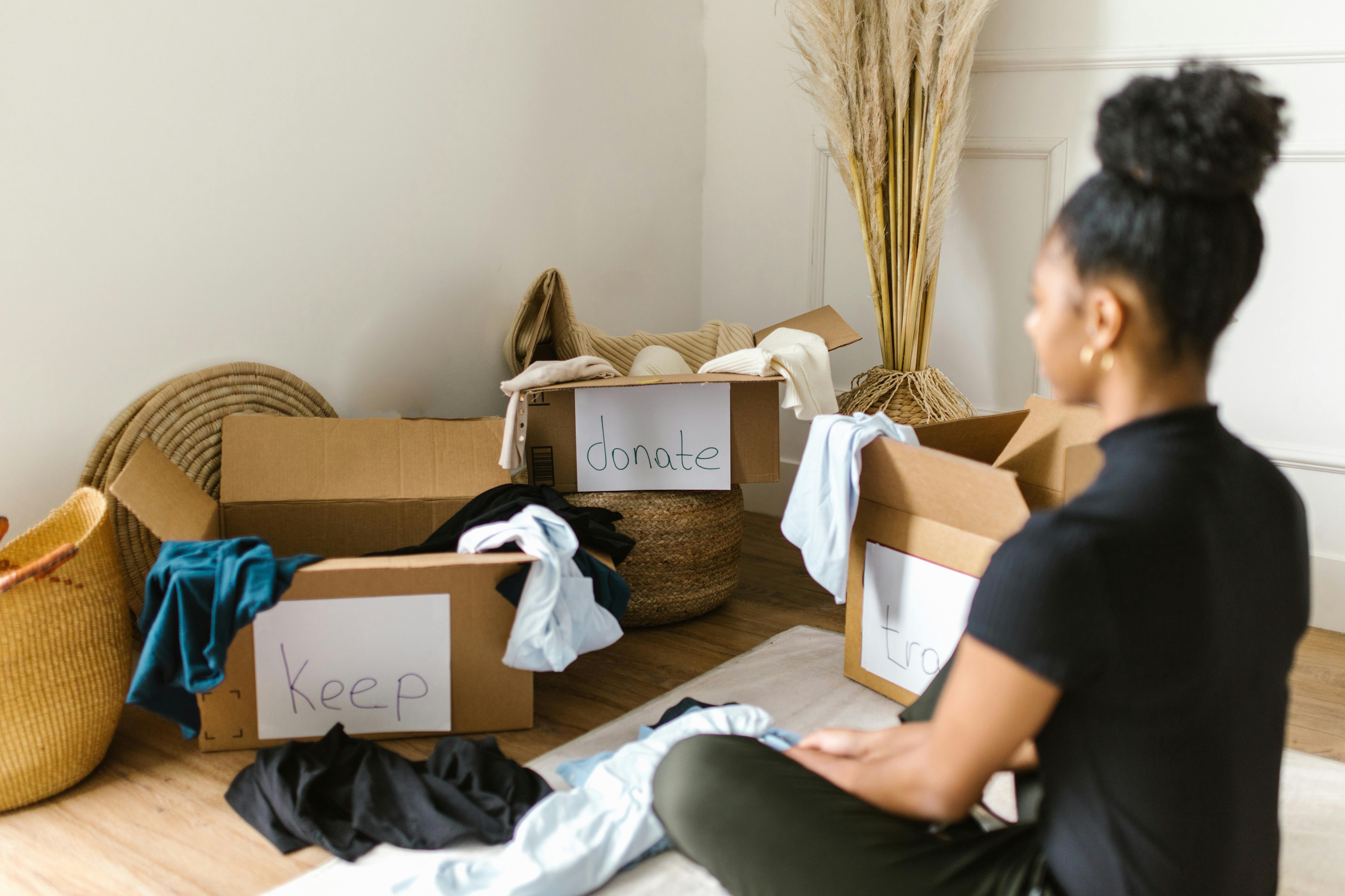 Woman decluttering her space | Source: Pexels