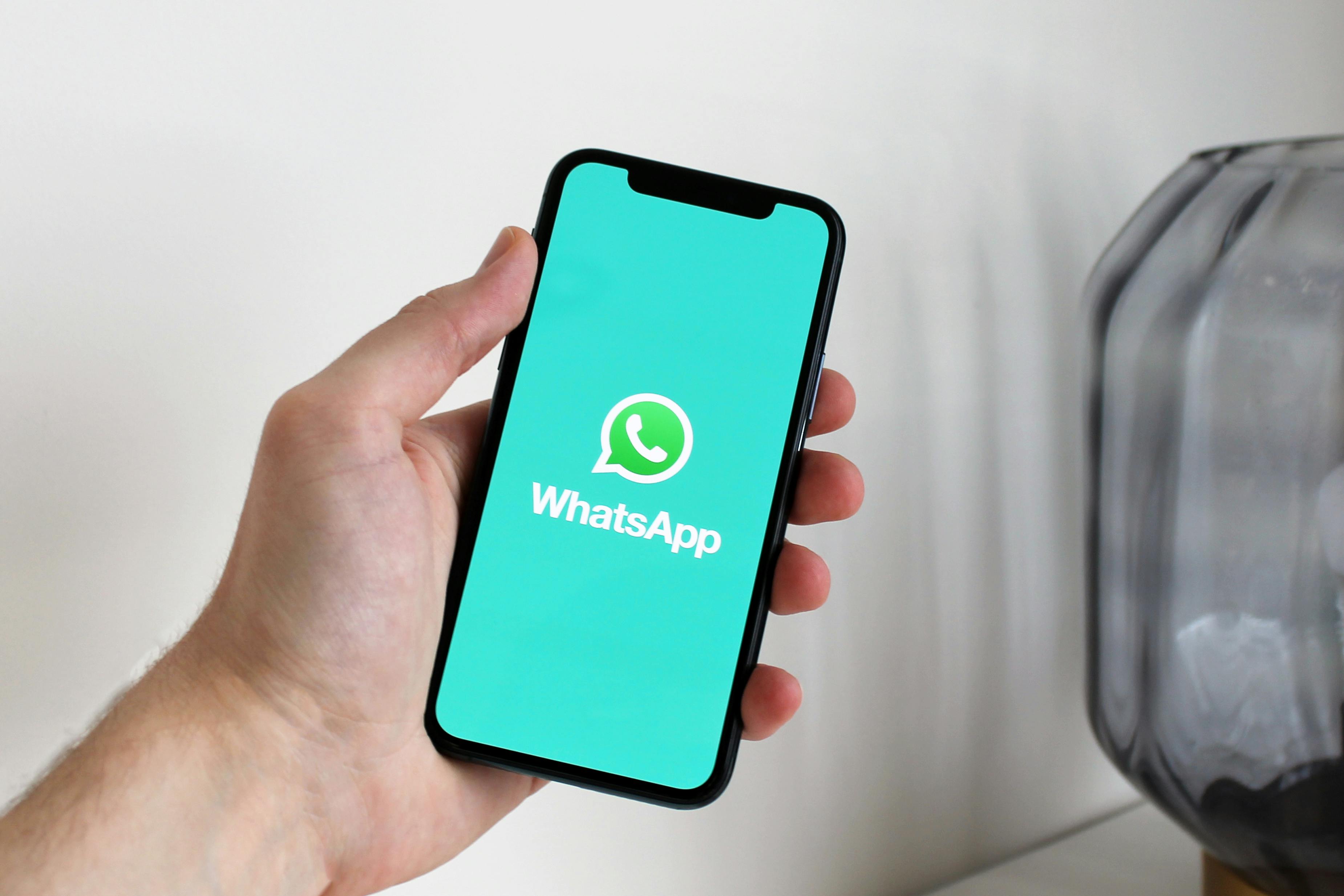 A person opening WhatsApp on a phone | Source: Pexels