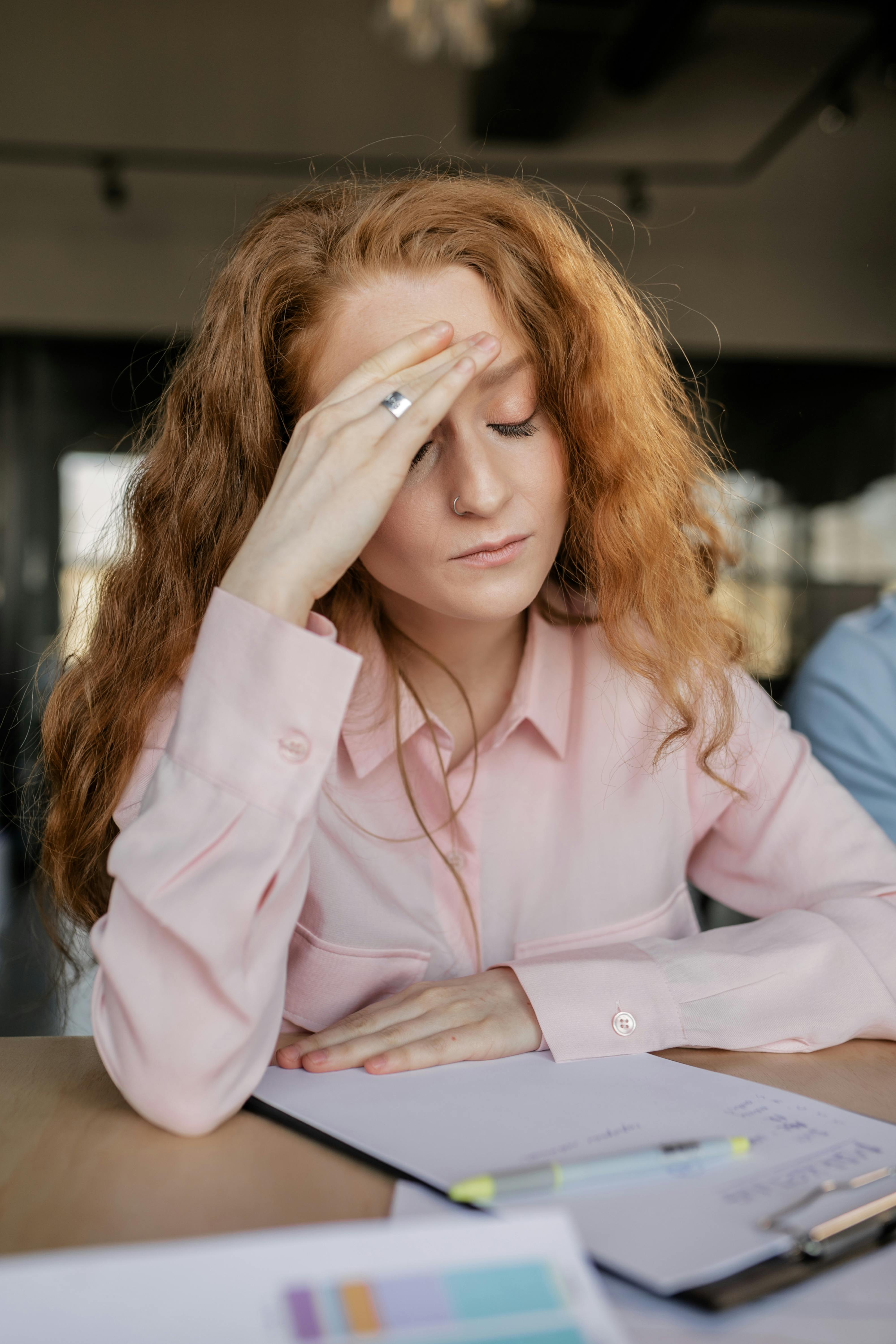 A frustrated woman sitting next to someone | Source: Pexels