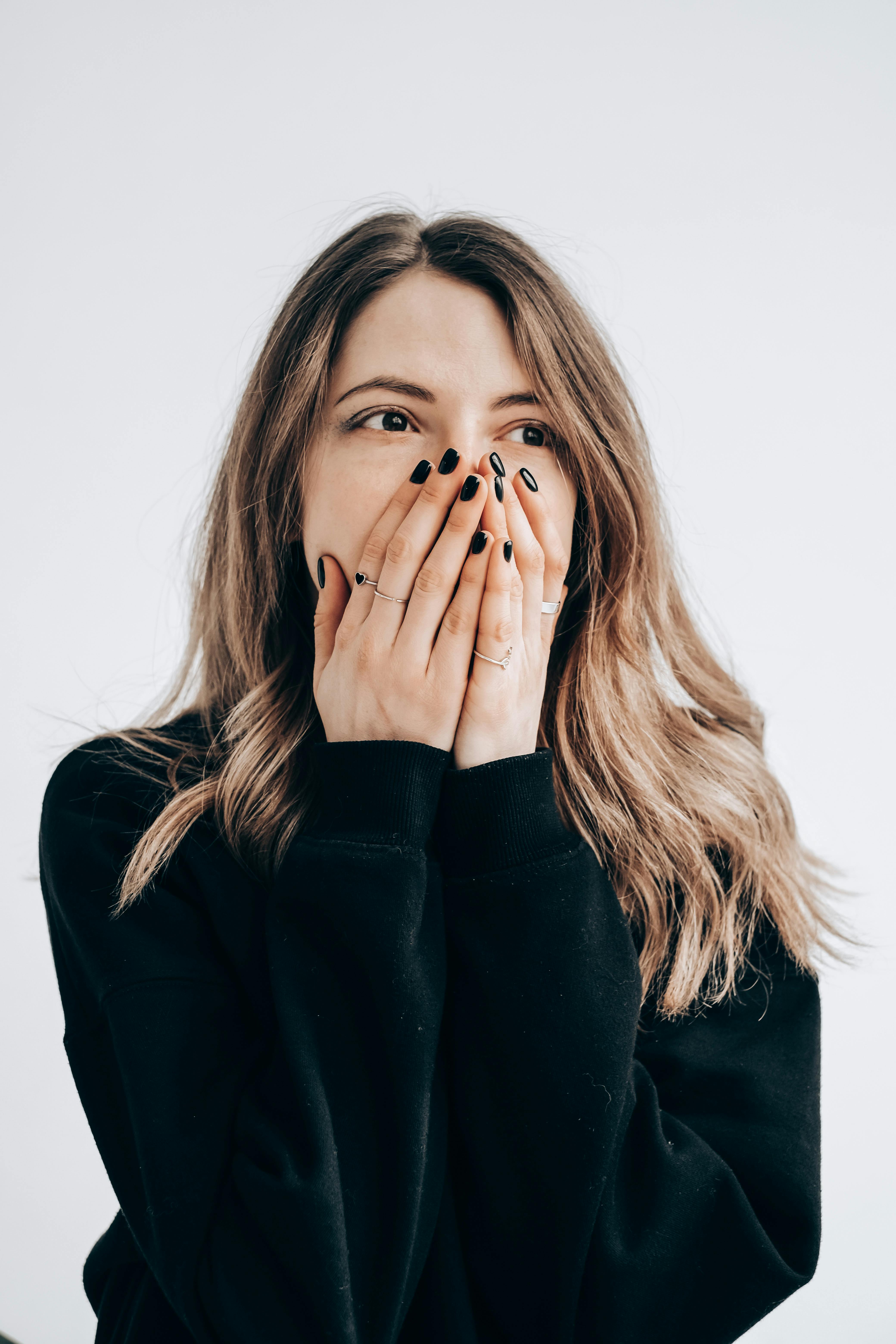 Shocked woman with hands on her face | Source: Pexels
