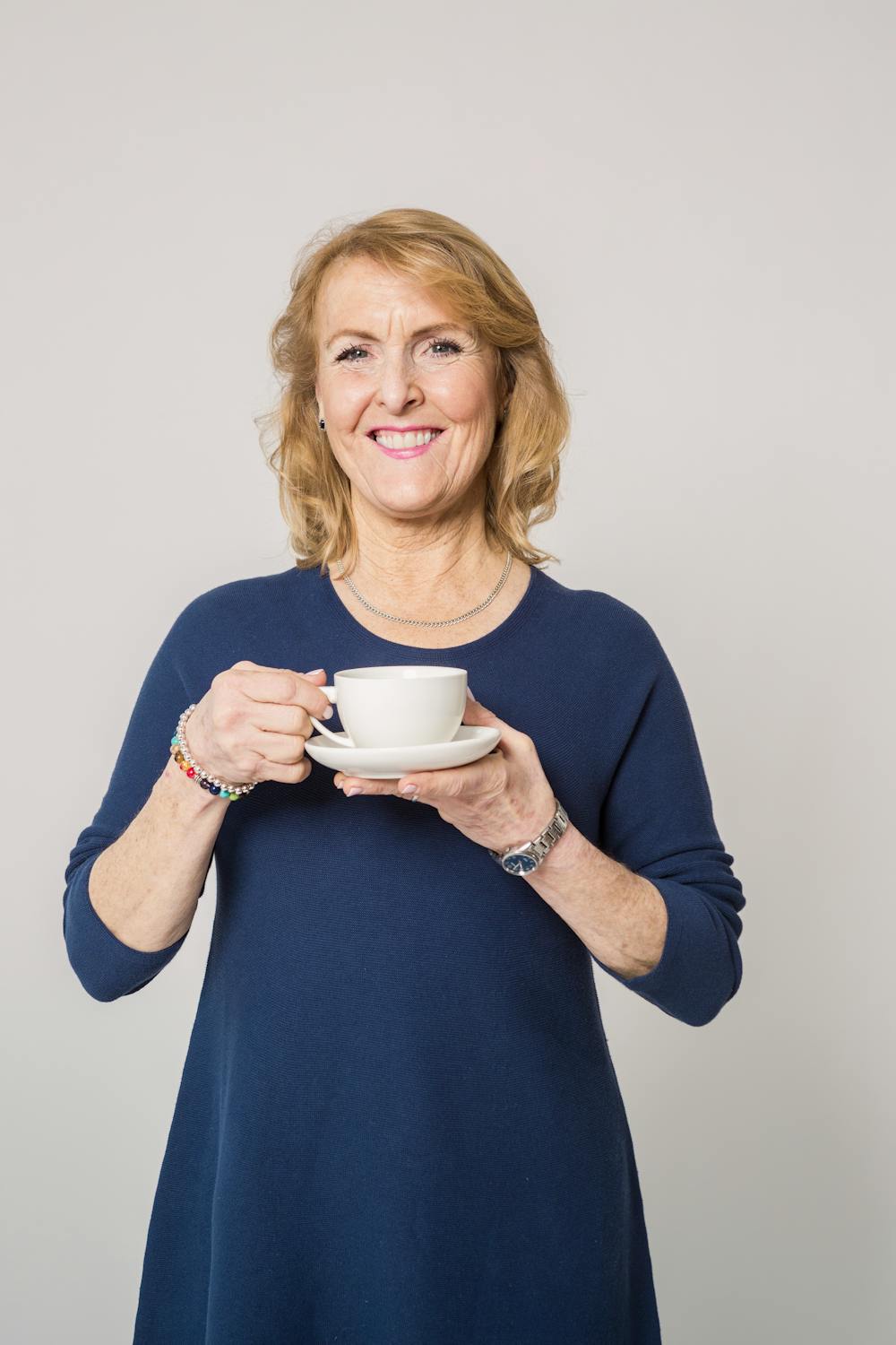 A smiling woman with a cup of tea | Source: Pexels