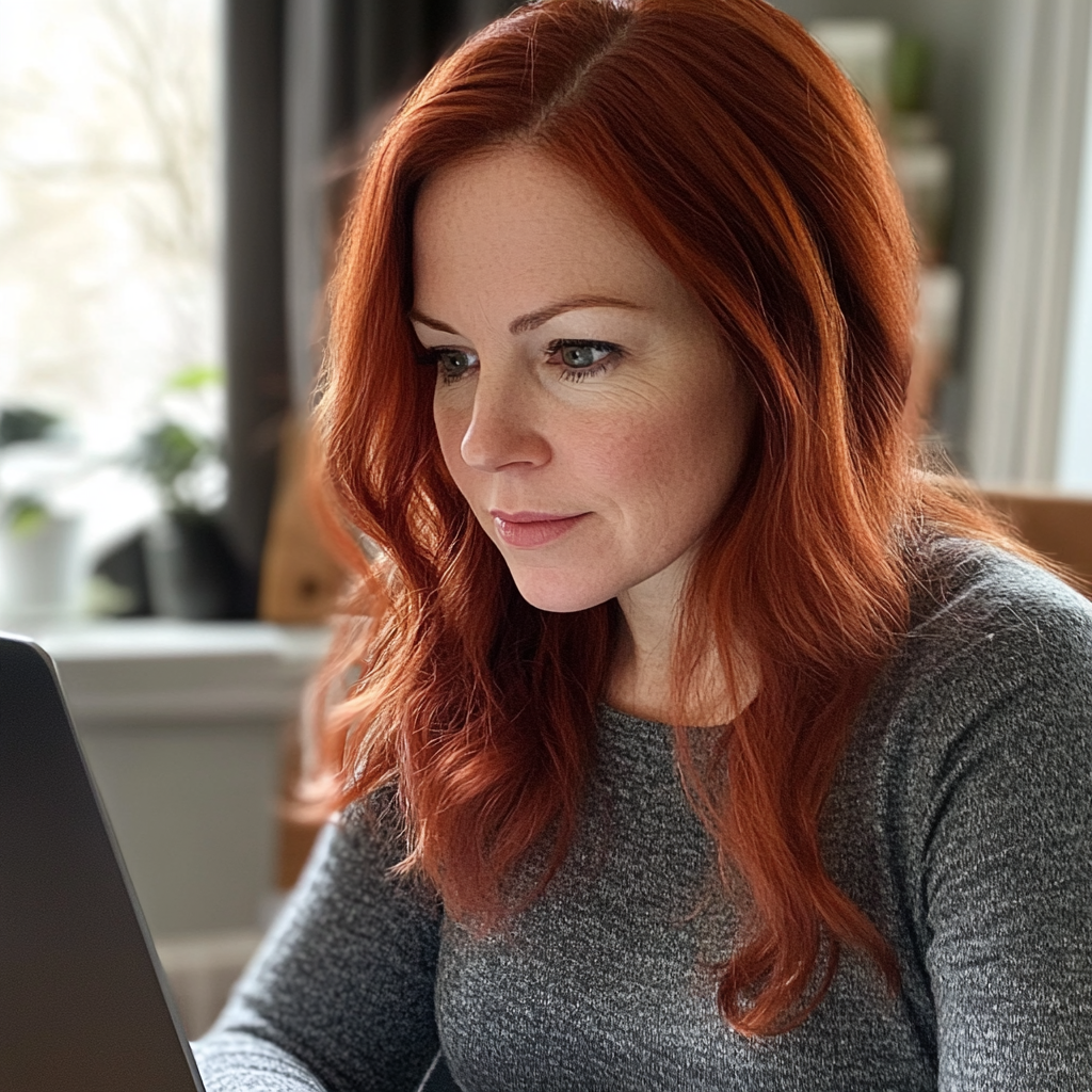 A woman using a laptop | Source: No source