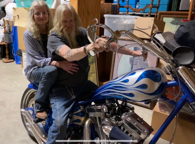 Ami Brown and Billy Brown on a bike at a storage place on April 3, 2023 | Source: Instagram/amibrownwolfpackmama