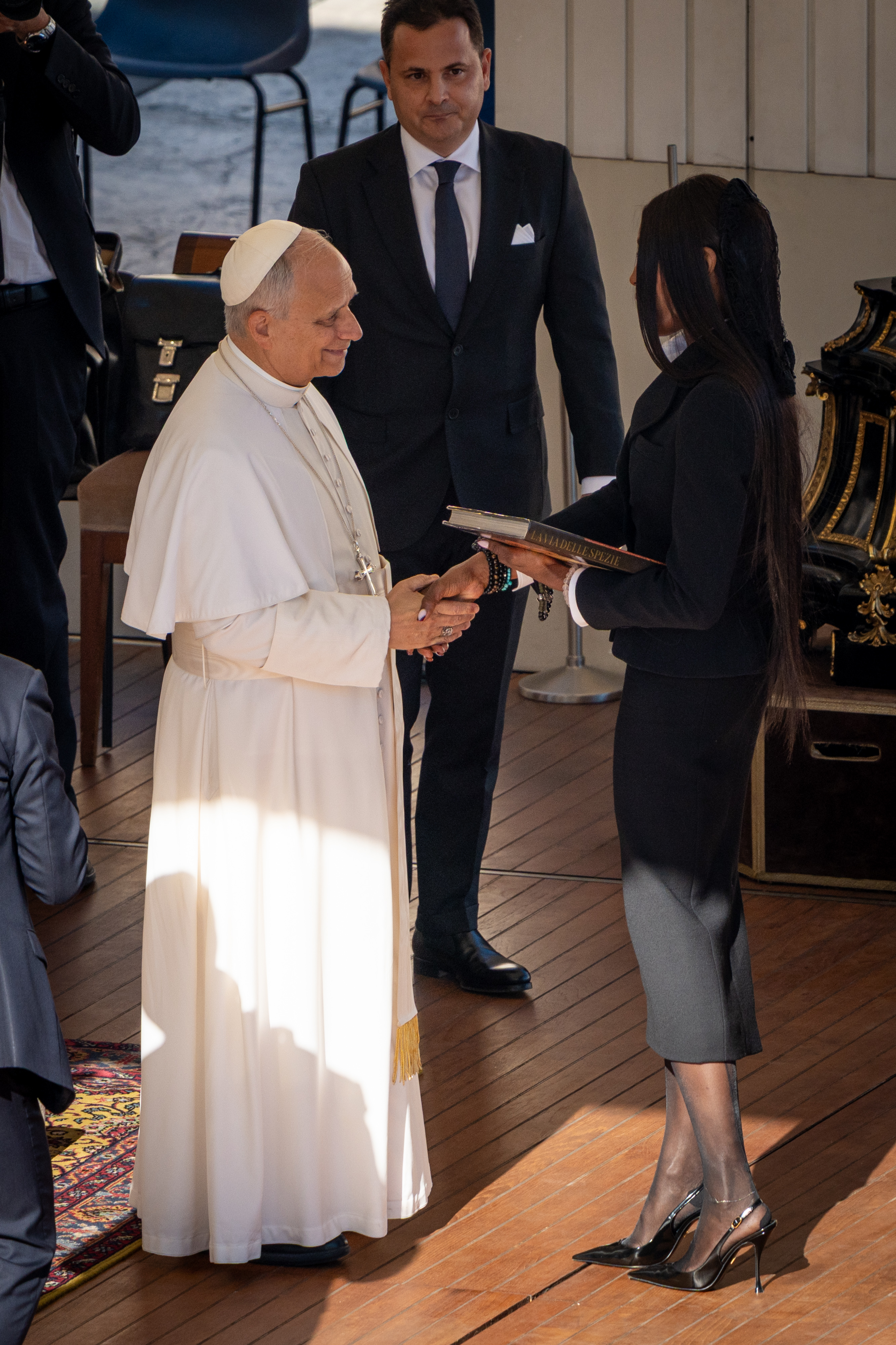 Pope Leo XIV shaking hands with the famous woman during their meeting. | Source: Getty Images