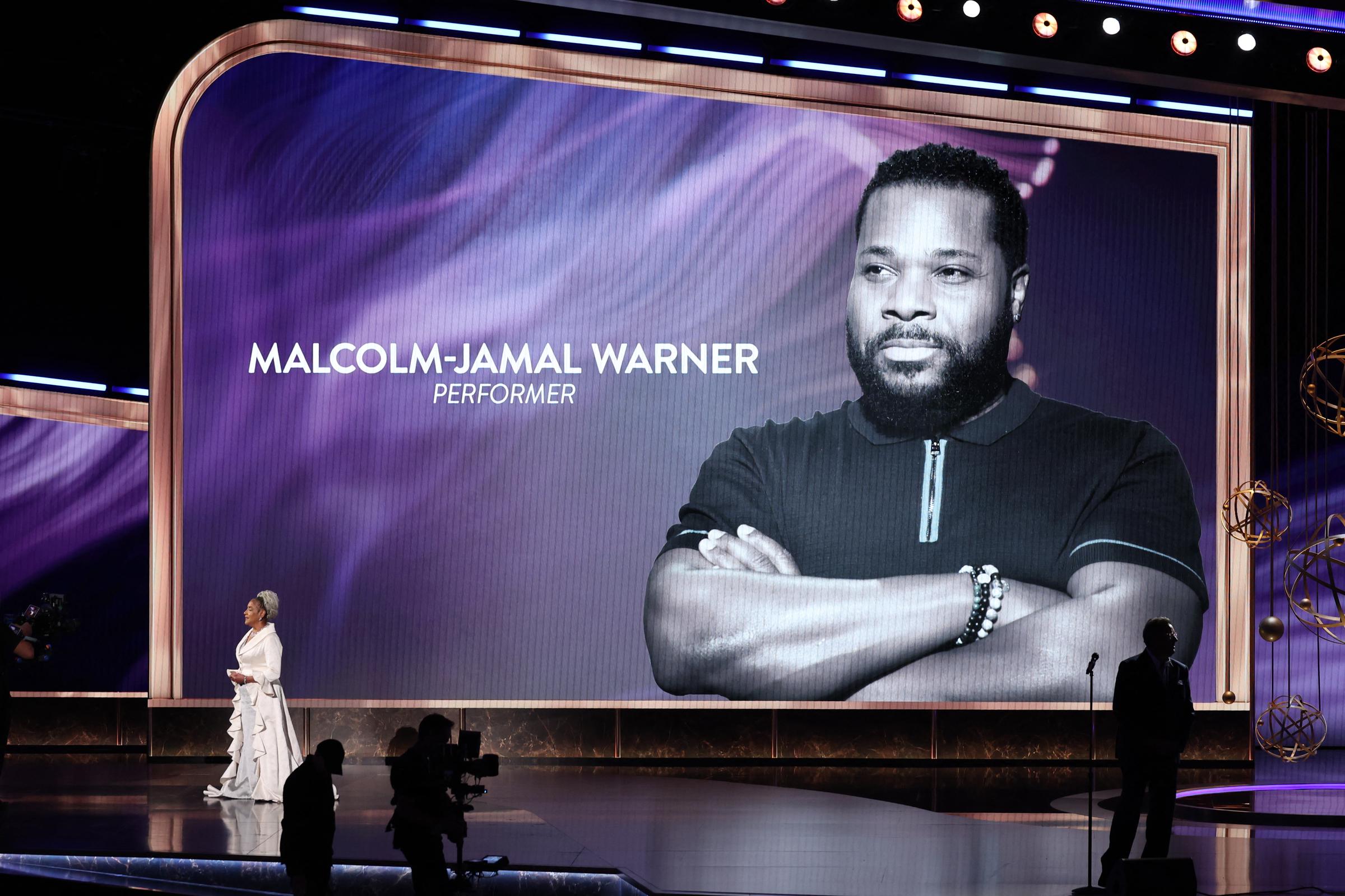 Phylicia Rashad speaks onstage besides a photo of Malcolm-Jamal Warner (1970 - 2025) during the 77th Primetime Emmy Awards at the Peacock Theatre at LA Live in California on September 14, 2025. | Source: Getty Images