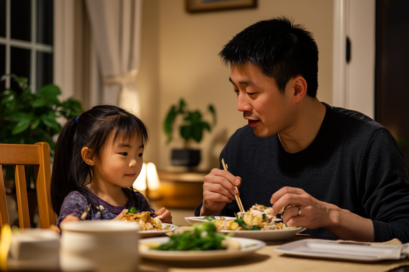 A man and his daughter eating dinner | Source: No source