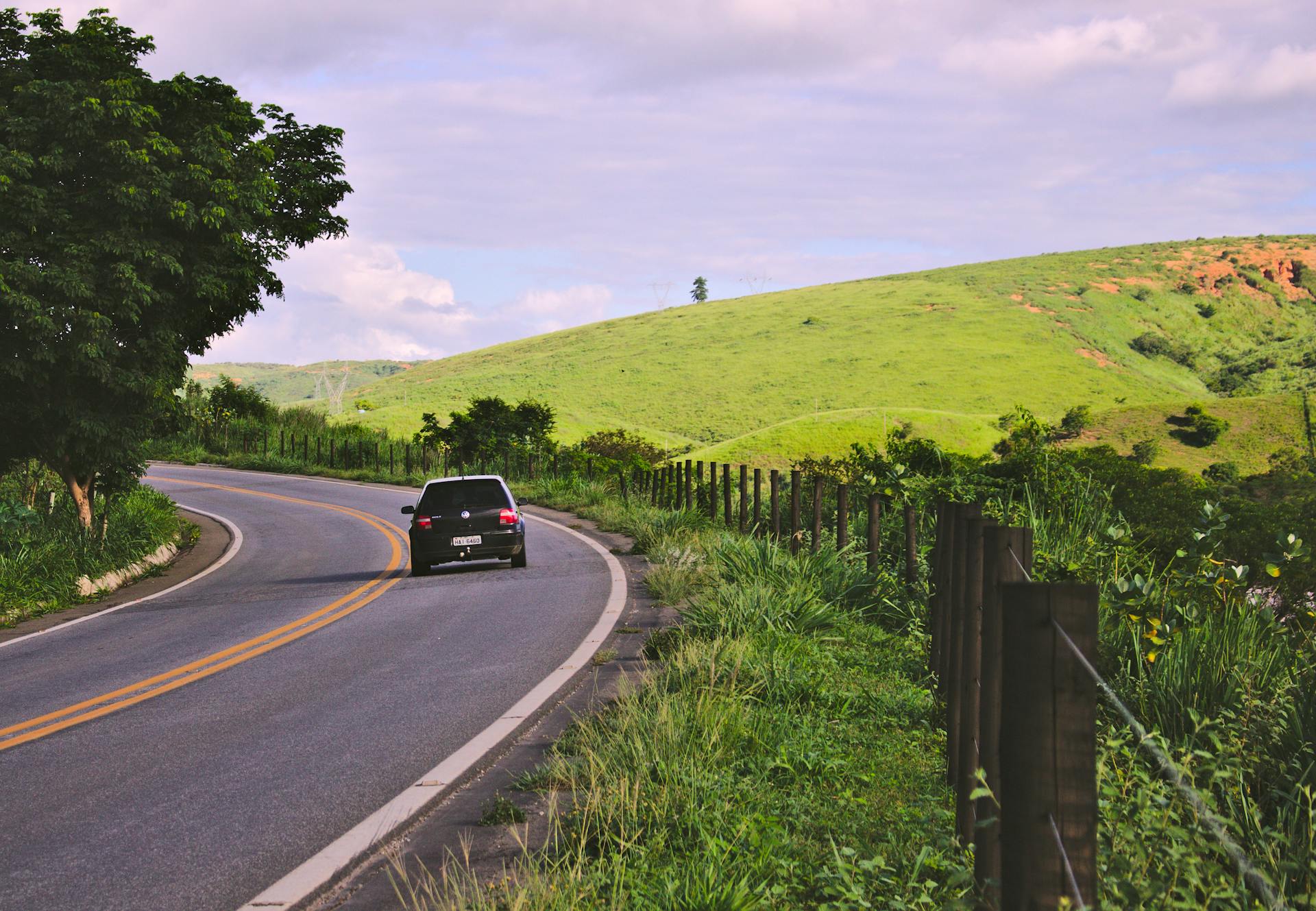 A car traveling on a country road | Source: Pexels
