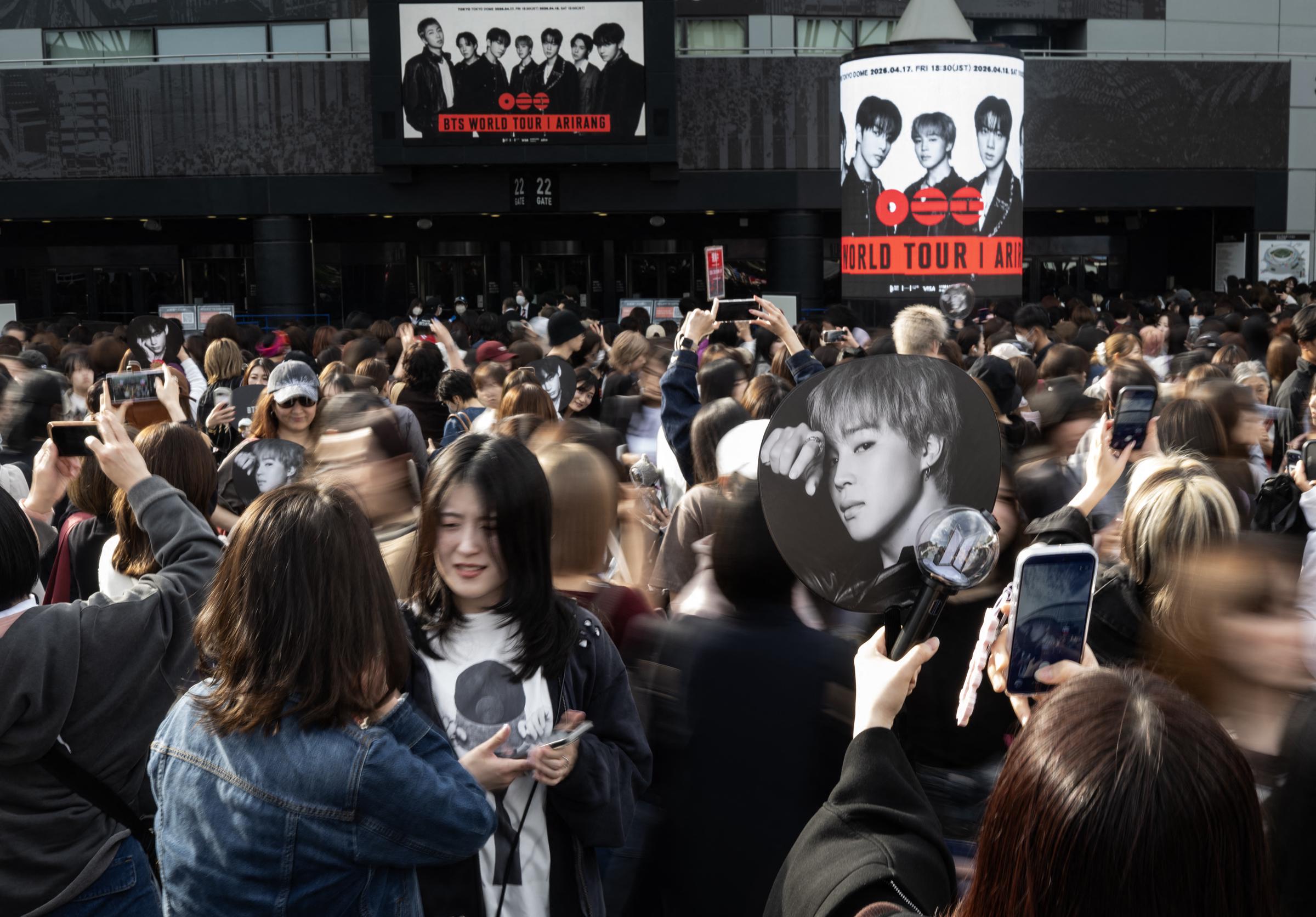 Fans of Korean boy band BTS line up at Tokyo Dome before the start of the first BTS World Tour 'Arirang' in Tokyo on April 17, 2026. | Source: Getty Images