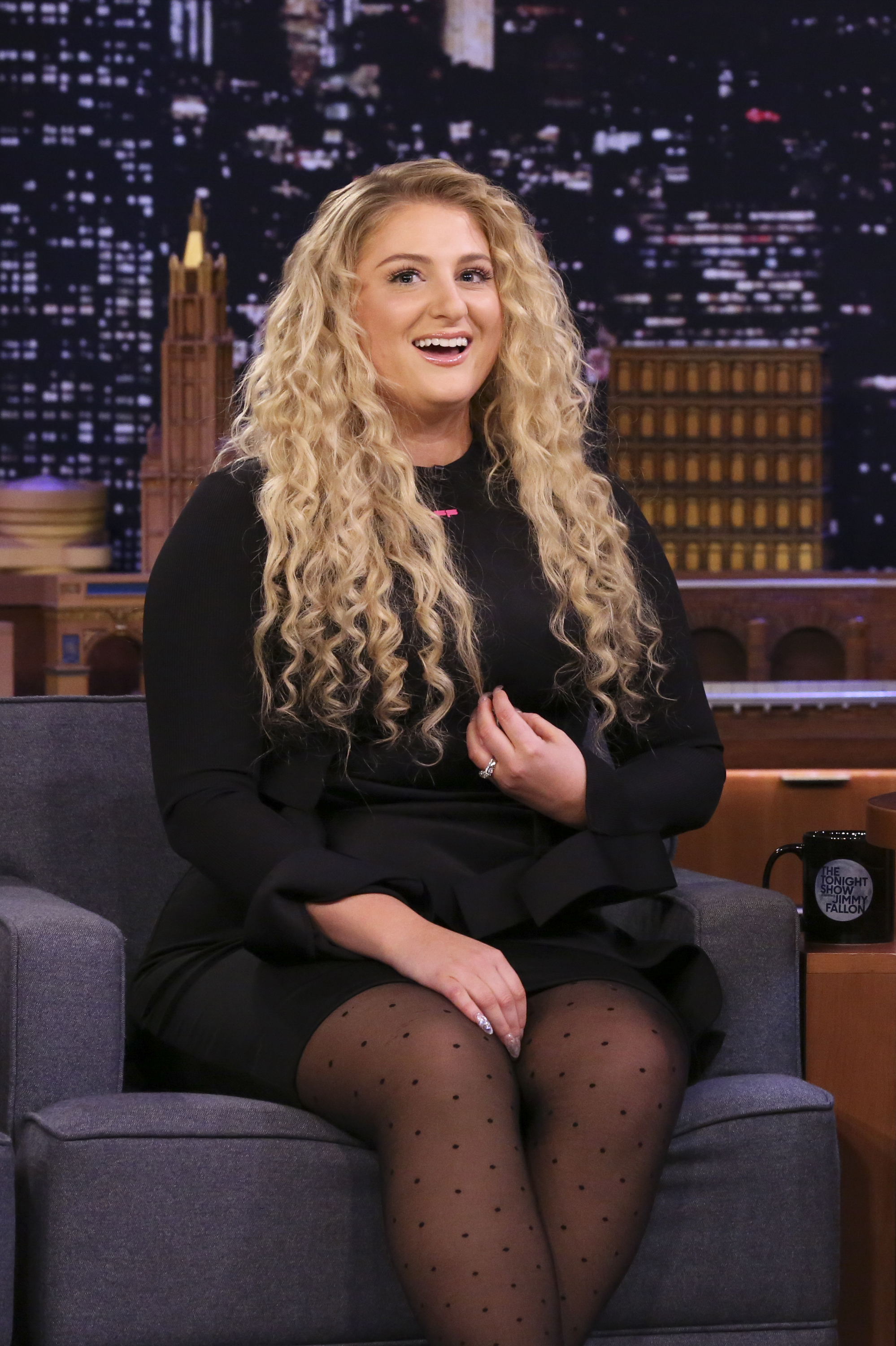 Meghan Trainor, 26, appeared with a full, beaming expression, rounded cheeks lifted in a wide, natural smile, and a soft, youthful jawline while being interviewed on "The Tonight Show Starring Jimmy Fallon" on February 6, 2020, in New York City.