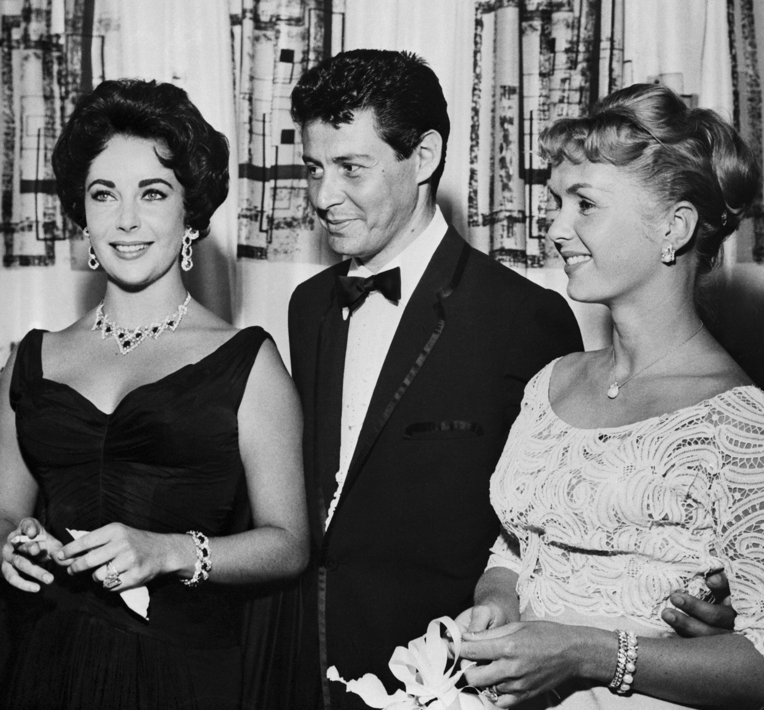 Singer Eddie Fisher is shown with his then-wife, Debbie Reynolds (right), and Elizabeth Taylor, circa June 1958 | Source: Getty Images