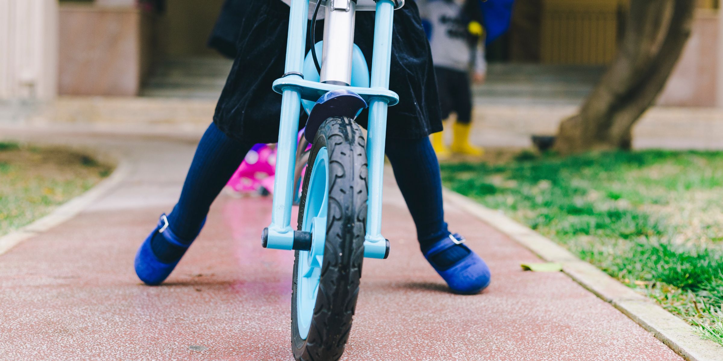 A close-up of a child riding a bike | Source: No source