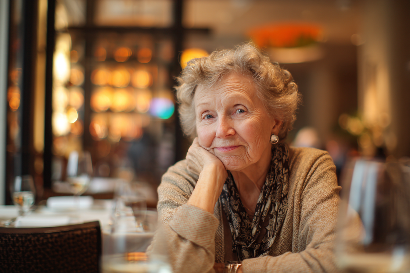 A woman in a restaurant staring at someone with disapproval | Source: No source