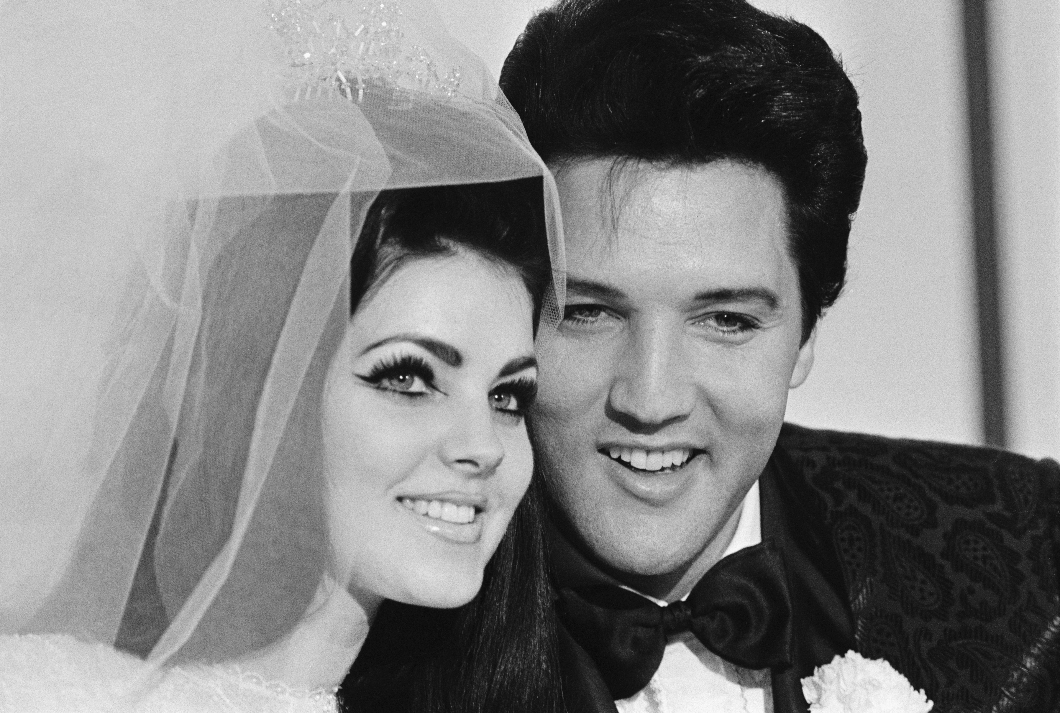 Elvis and Priscilla Presley pose for a photograph following their wedding at the Aladdin Hotel on May 1, 1967, in Las Vegas, Nevada | Source: Getty Images