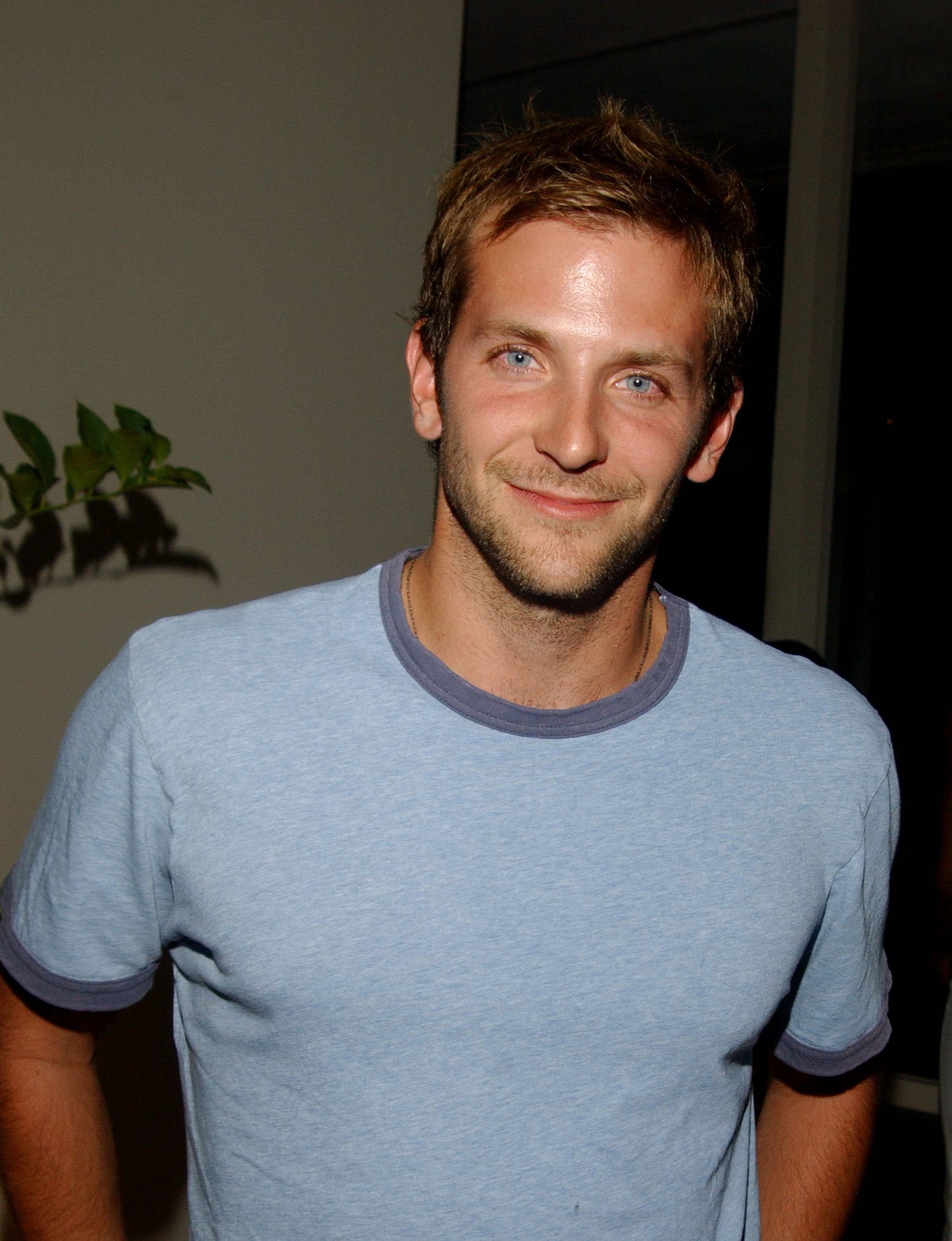 Bradley Cooper, 28, looked distinctly younger compared to his later roles. His face showed his striking blue eyes, minimal stubble, and slightly reddened cheeks during the Teen Vogue Young Hollywood Party at a Private Residence on September 5, 2003, in Beverly Hills, California.