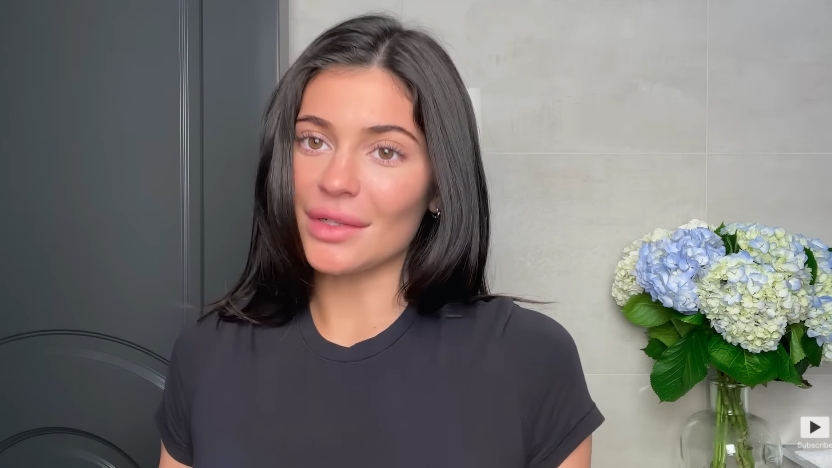 Kylie Jenner getting ready to do her classic beauty routine from a video dated April 6, 2023. | Source: YouTube/Vogue