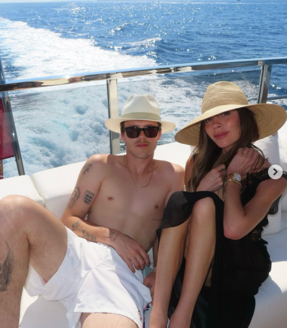 Cruz and Victoria Beckham pose together on a yacht in a post dated August 10, 2025 | Source: Instagram/victoriabeckham
