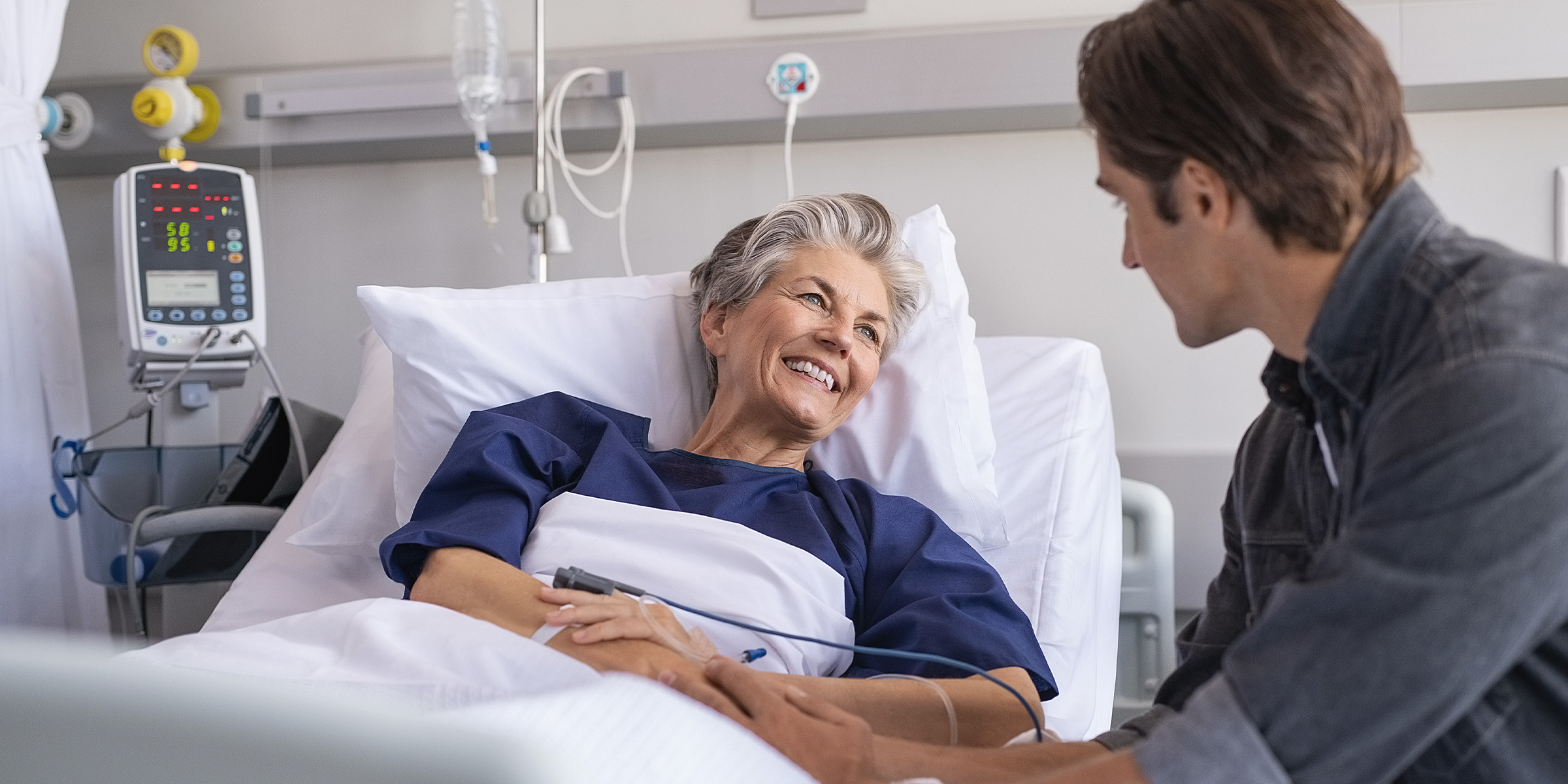 A man visiting his mother in hospital | Source: Shutterstock