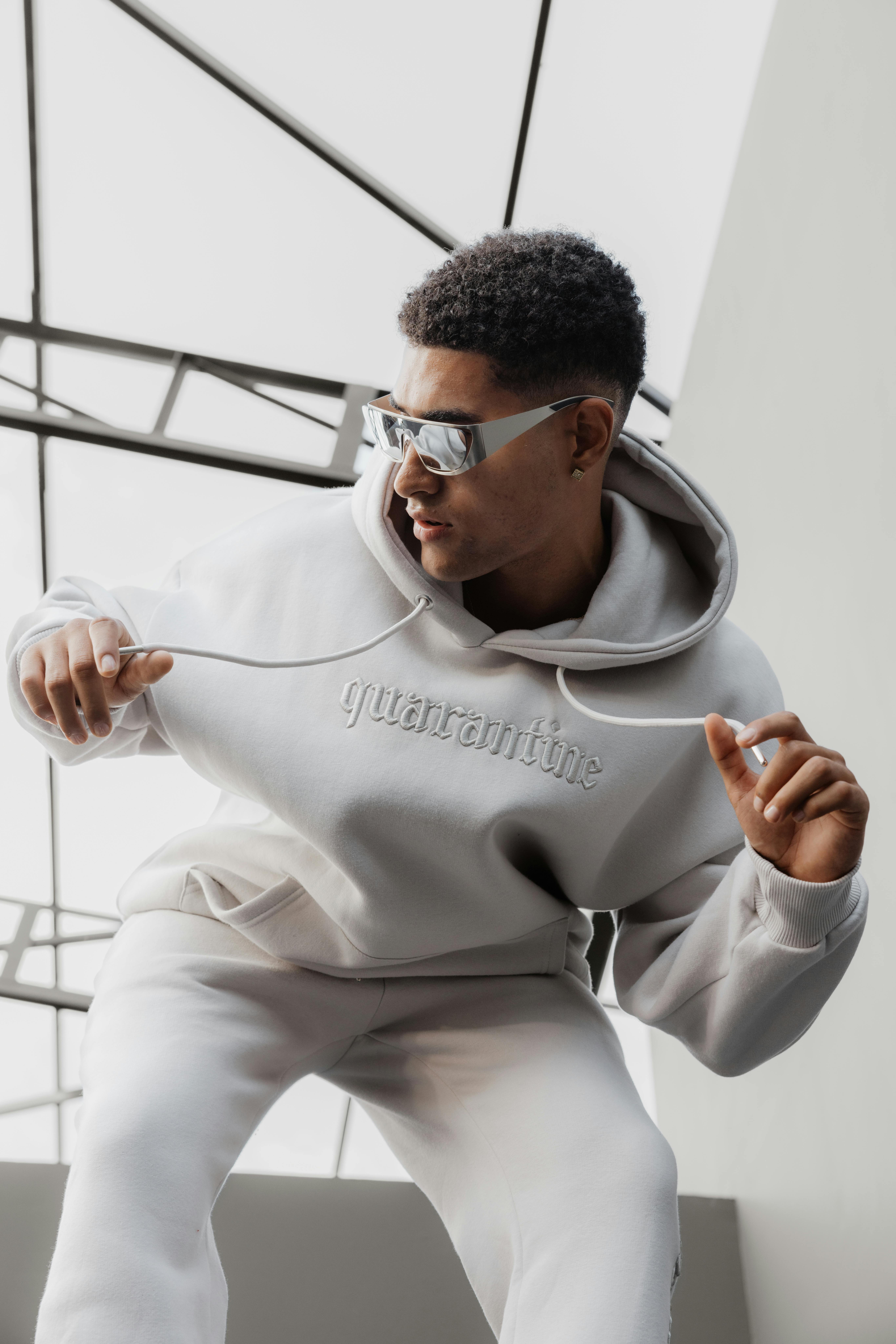 Man wearing a grey hoodie with lettering | Source: Pexels