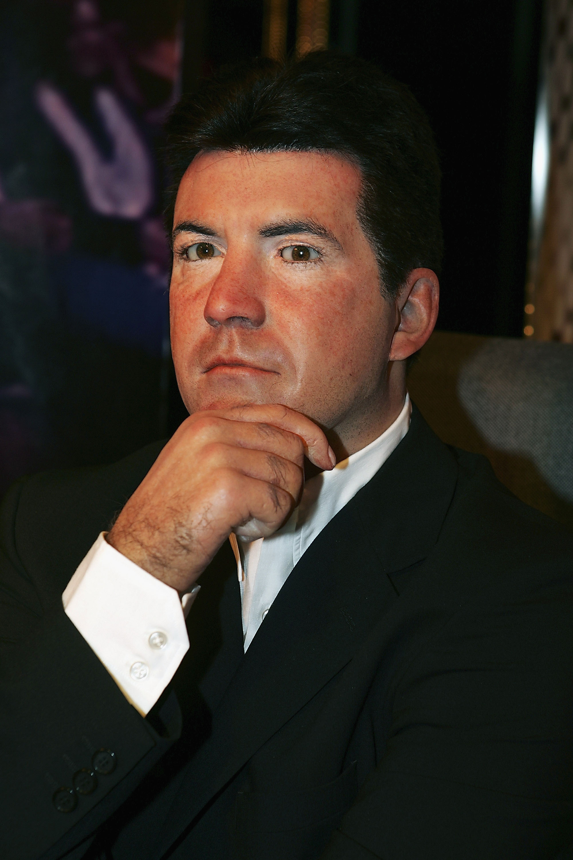 Captured in 2005 at Madame Tussauds London, Cowell strikes a famously icy pose, chin in hand, perfectly channeling the no-nonsense persona that had viewers — and contestants — trembling across two continents.