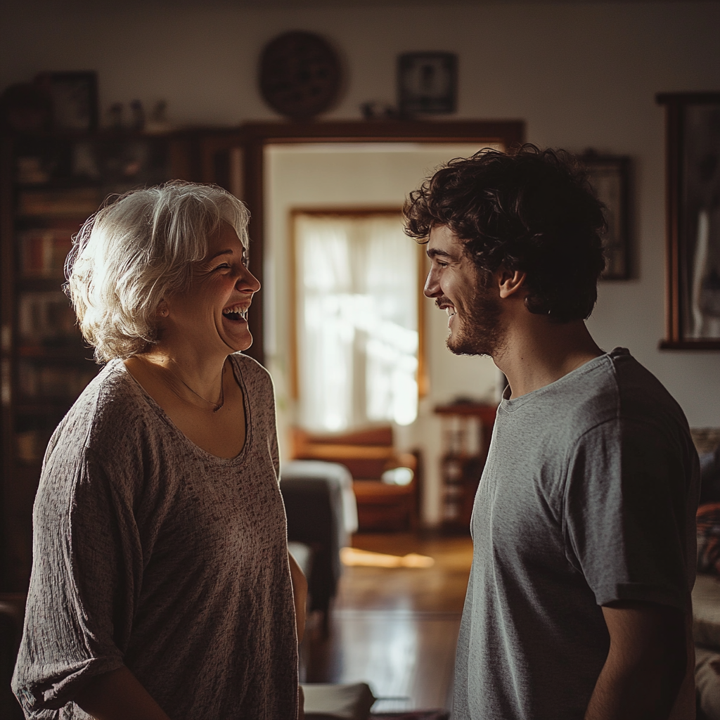 A woman laughing with her son | Source: No source