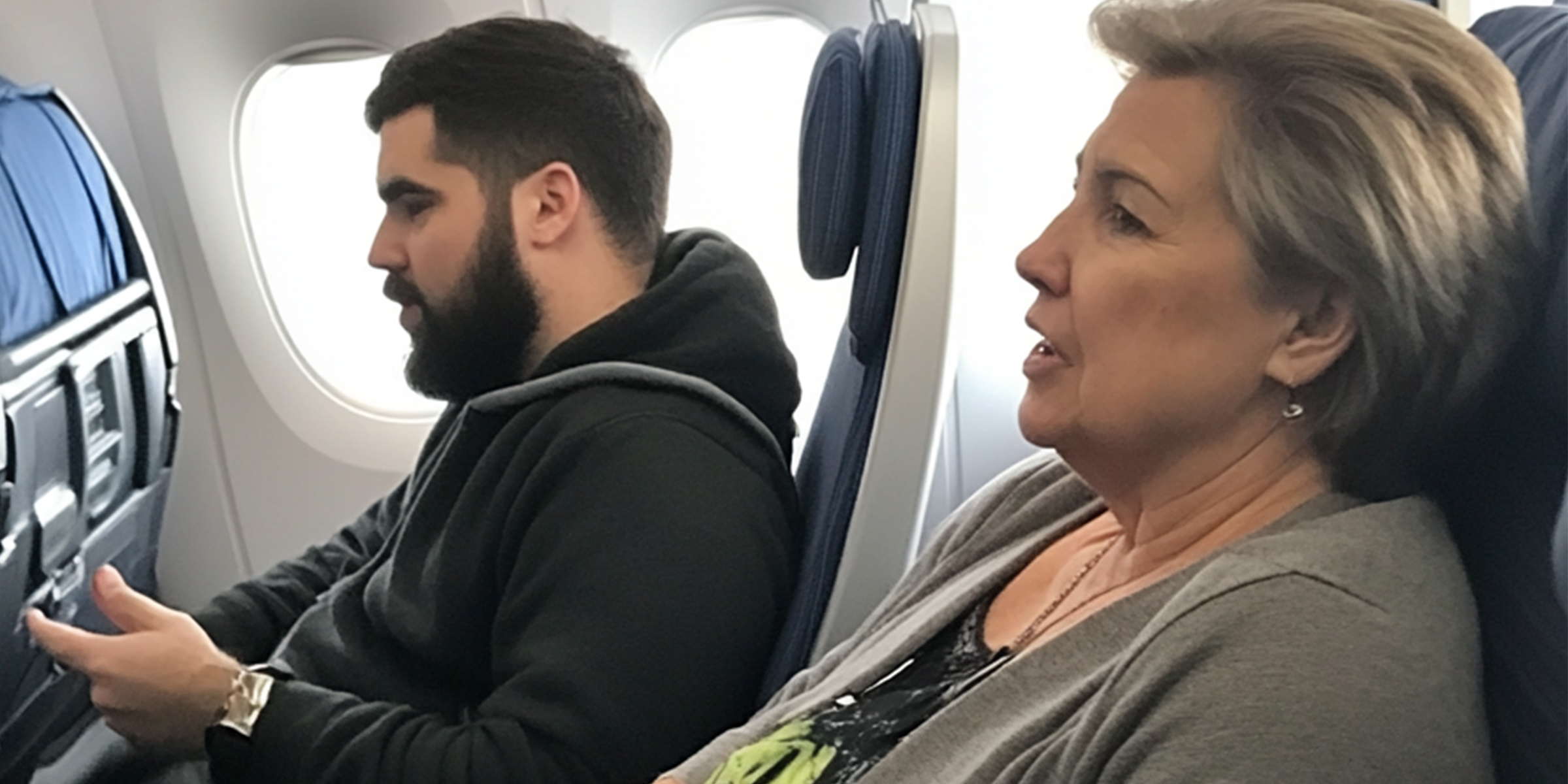 A man and an older woman sitting in an airplane | Source: No source
