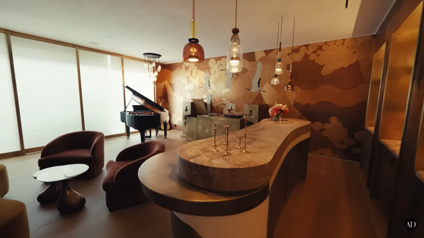 Chrissy Teigen and John Legend's piano bar at their Beverly Hills home | Source: YouTube/ArchitecturalDigest