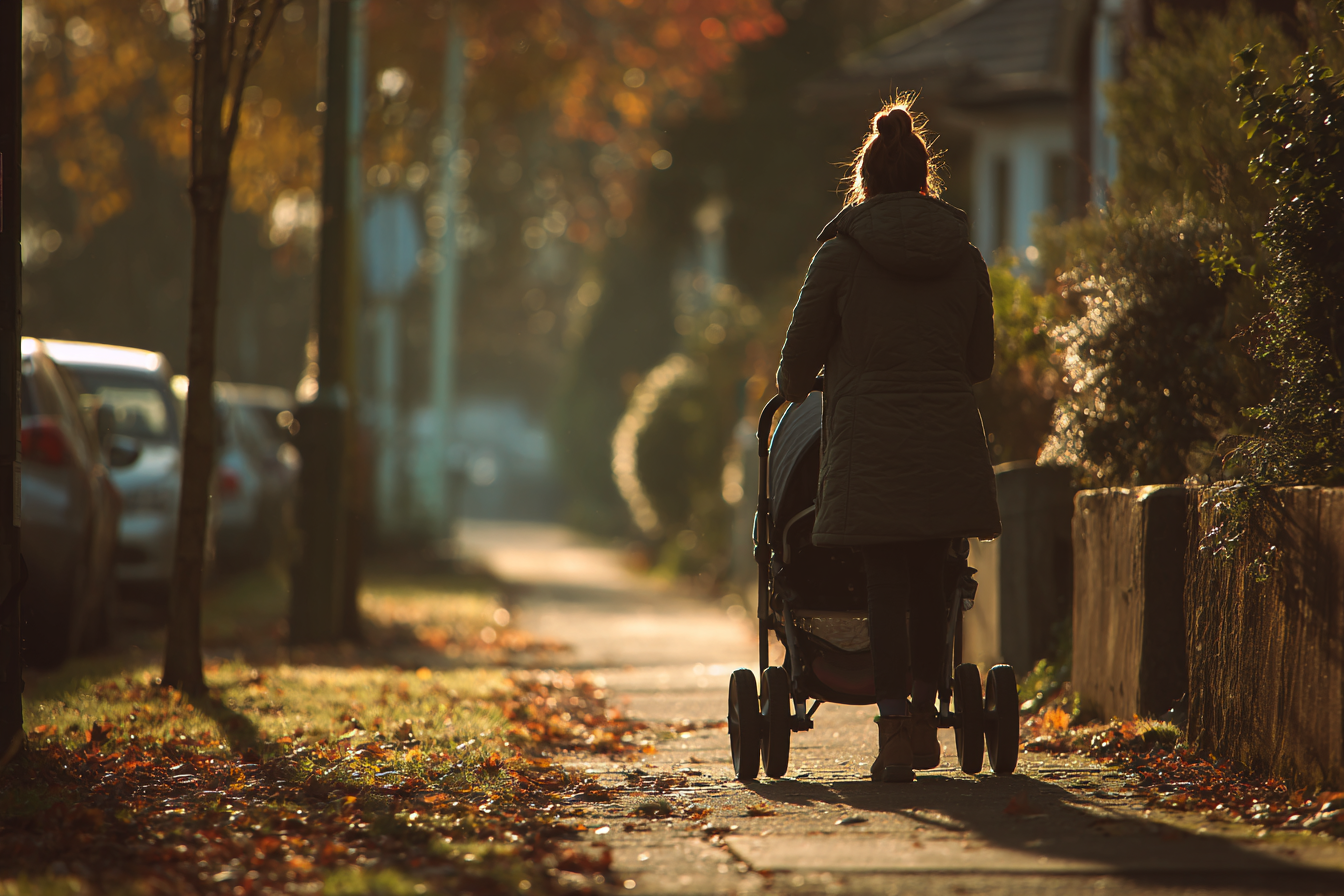 A woman walking on a sidewalk | Source: no source