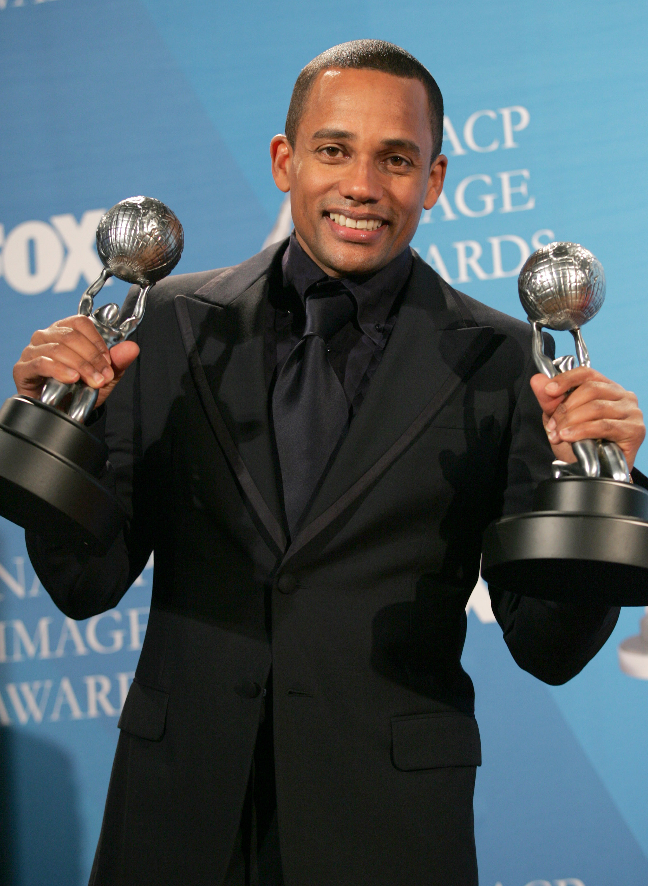 The TV star celebrates his double win for "Letters to a Young Brother" at the 38th NAACP Image Awards on March 2, 2007 | Source: Getty Images