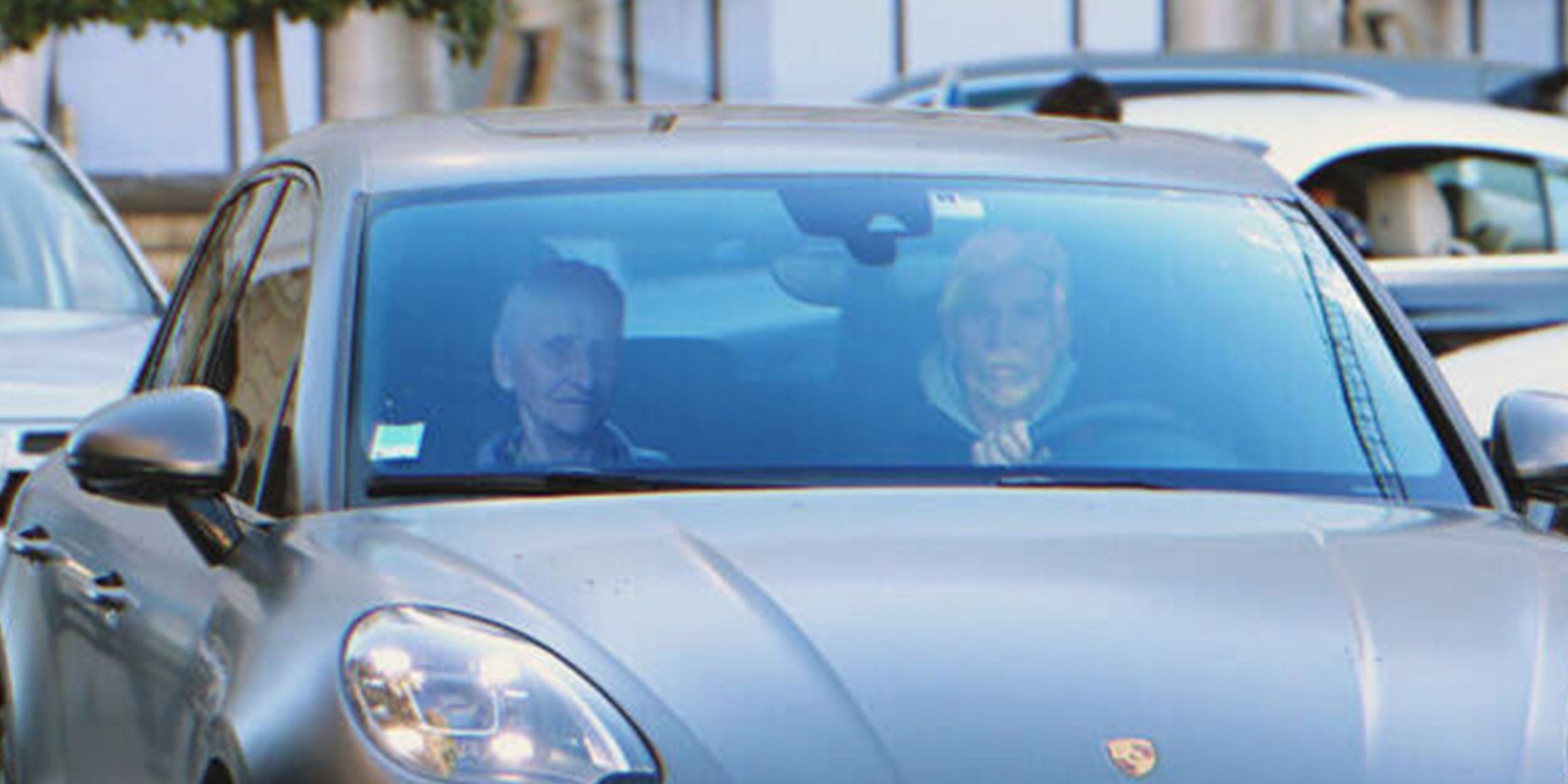 Two man driving a sports car | Source: Shutterstock
