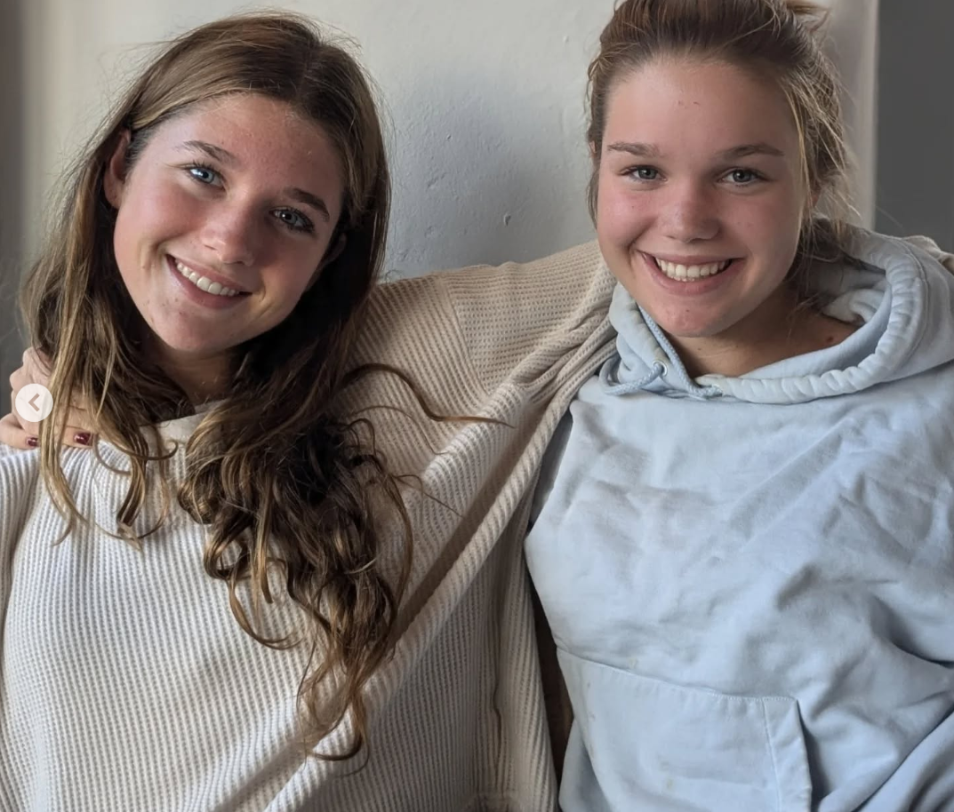 Jerry O'Connell's twin daughters, Dolly Rebecca Rose and Charlie Tamara Tulip, embracing each other in a post dated December 28, 2024 | Source: Instagram/mrjerryoc