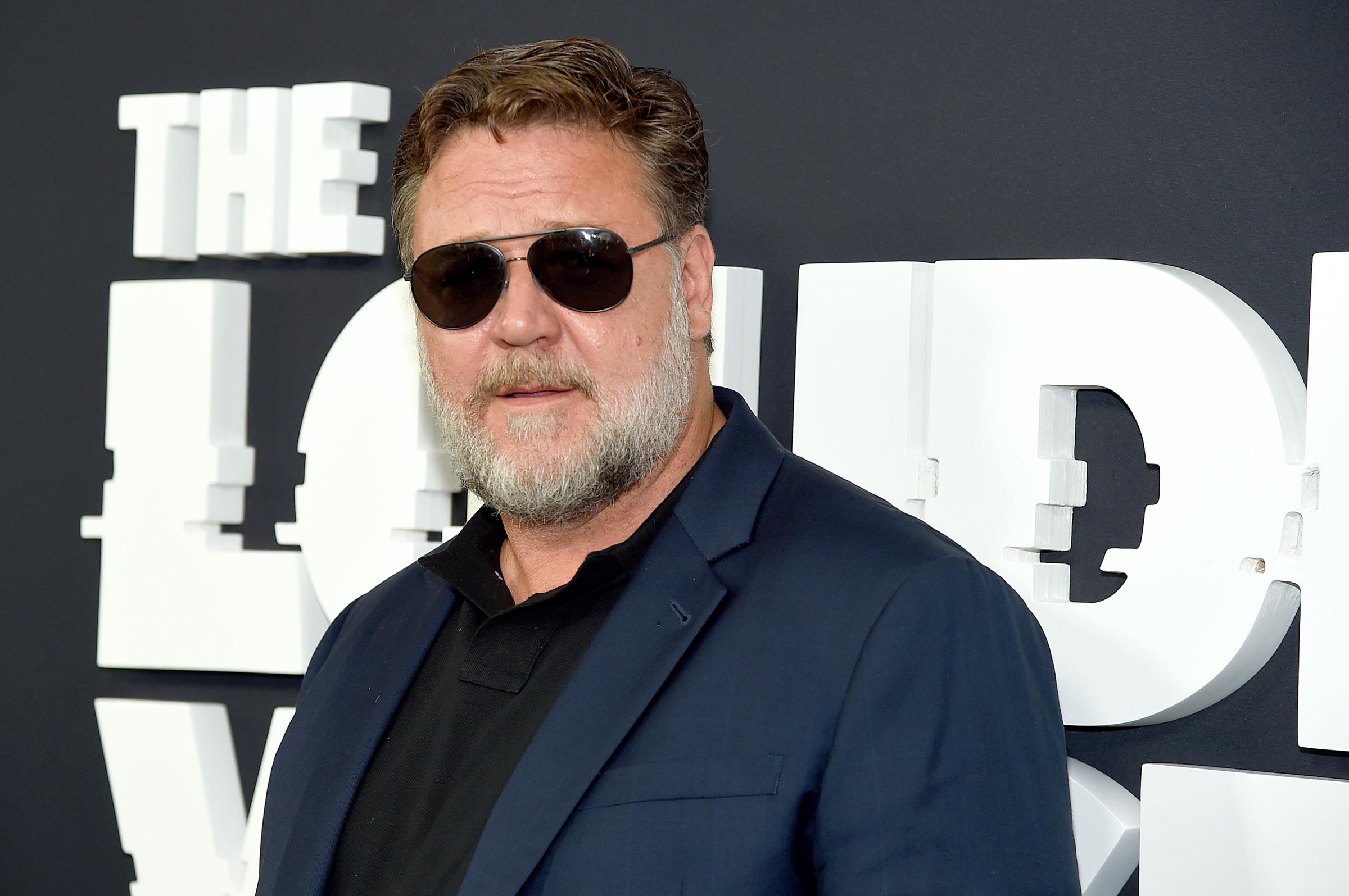 Russell Crowe attended the premiere of "The Loudest Voice" on June 24, 2019, in New York, wearing a navy blazer over a black polo and aviator sunglasses. With his gray beard and stockier frame, the actor presented a commanding look during a period of physical transformation for his role as Roger Ailes in the Showtime series.