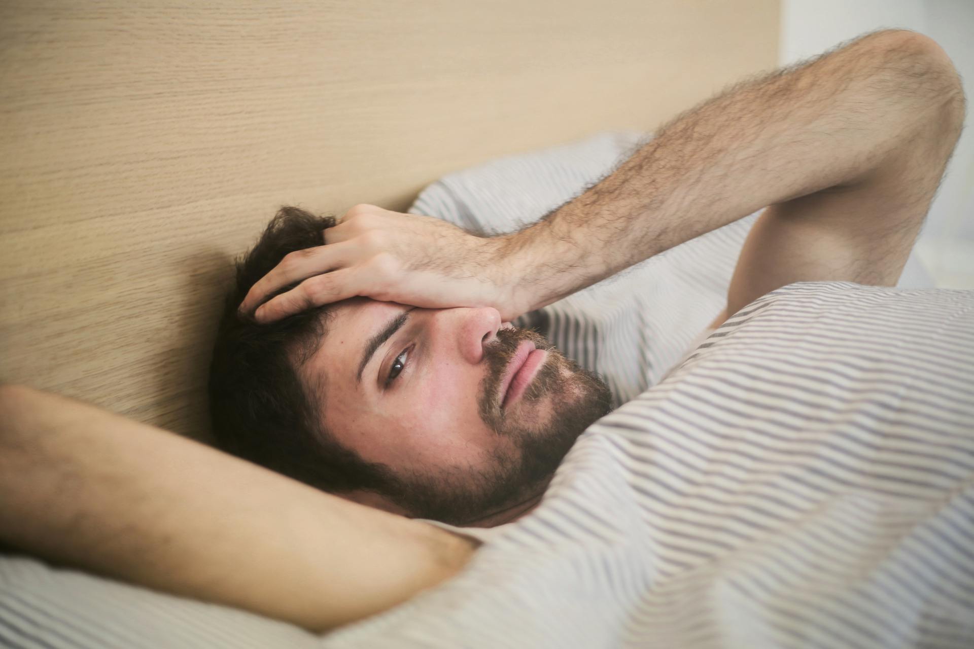 A man lying in bed | Source: Pexels