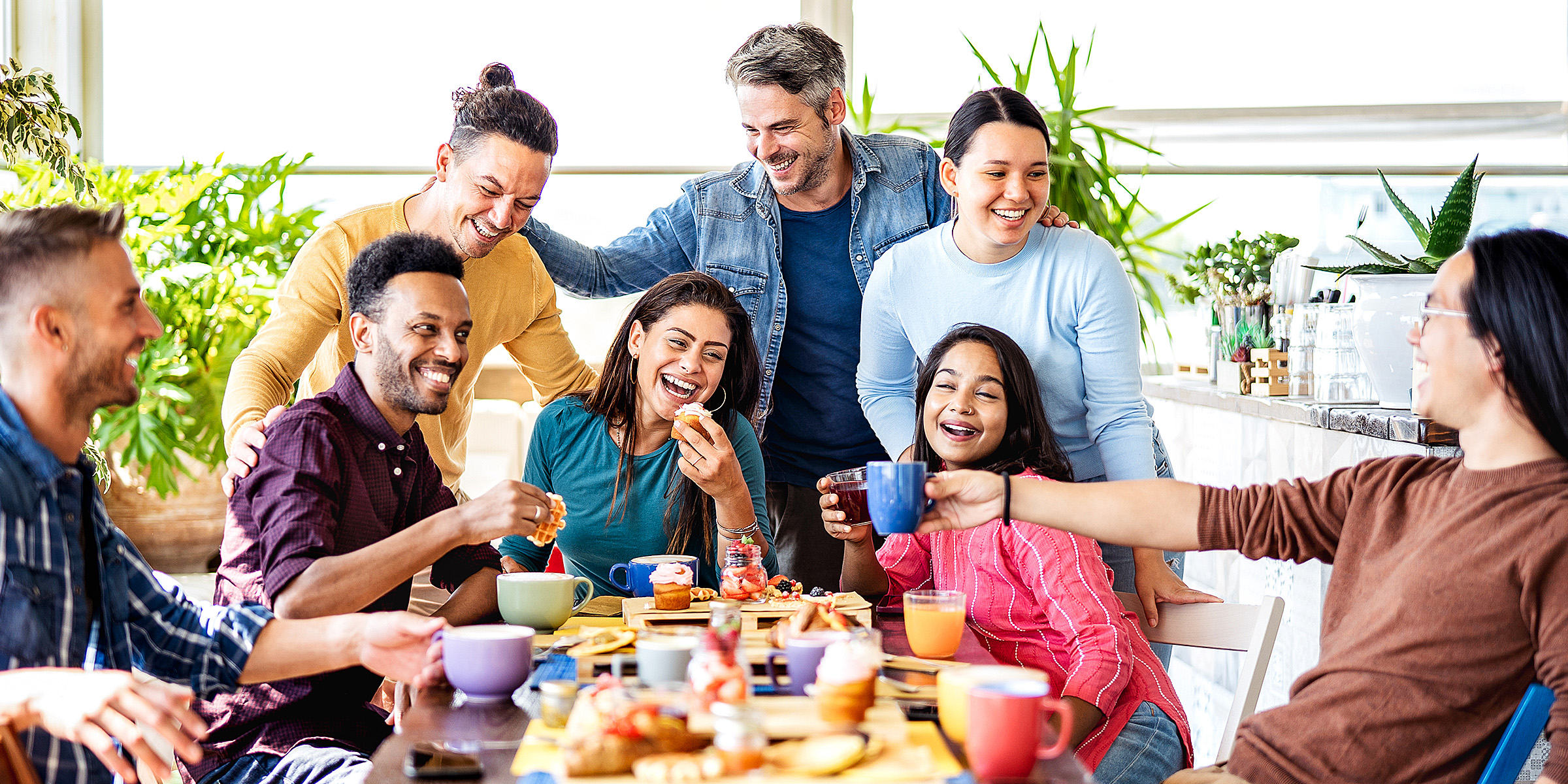 A group of people gathered at a celebration | Source: Shutterstock