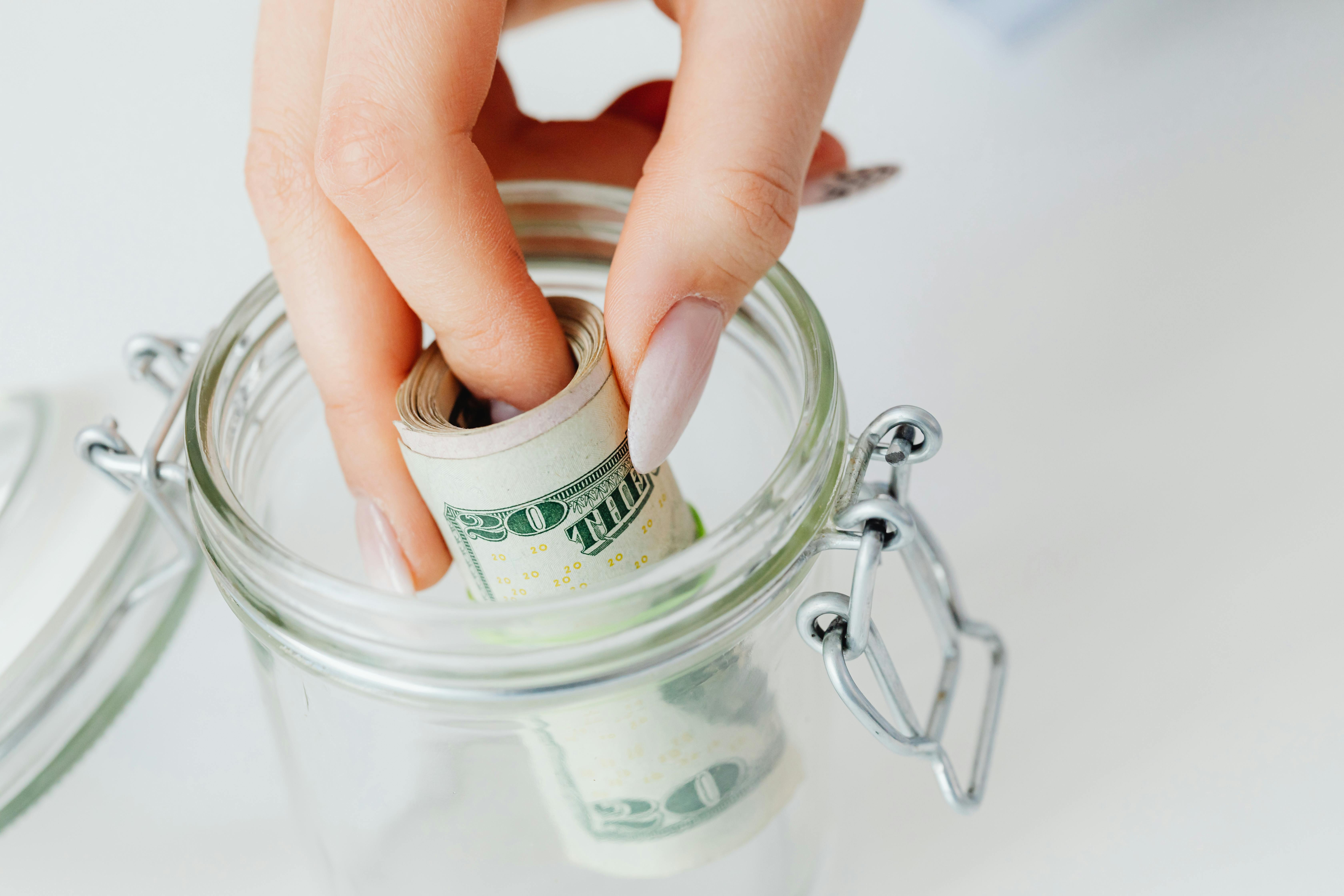 Person saving money | Source: Pexels