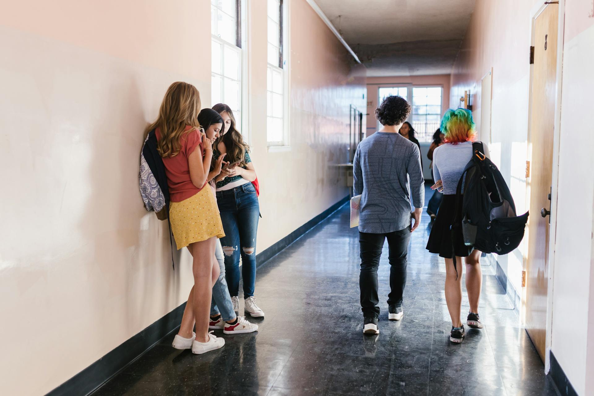 Students in a high school corridor | Source: Pexels