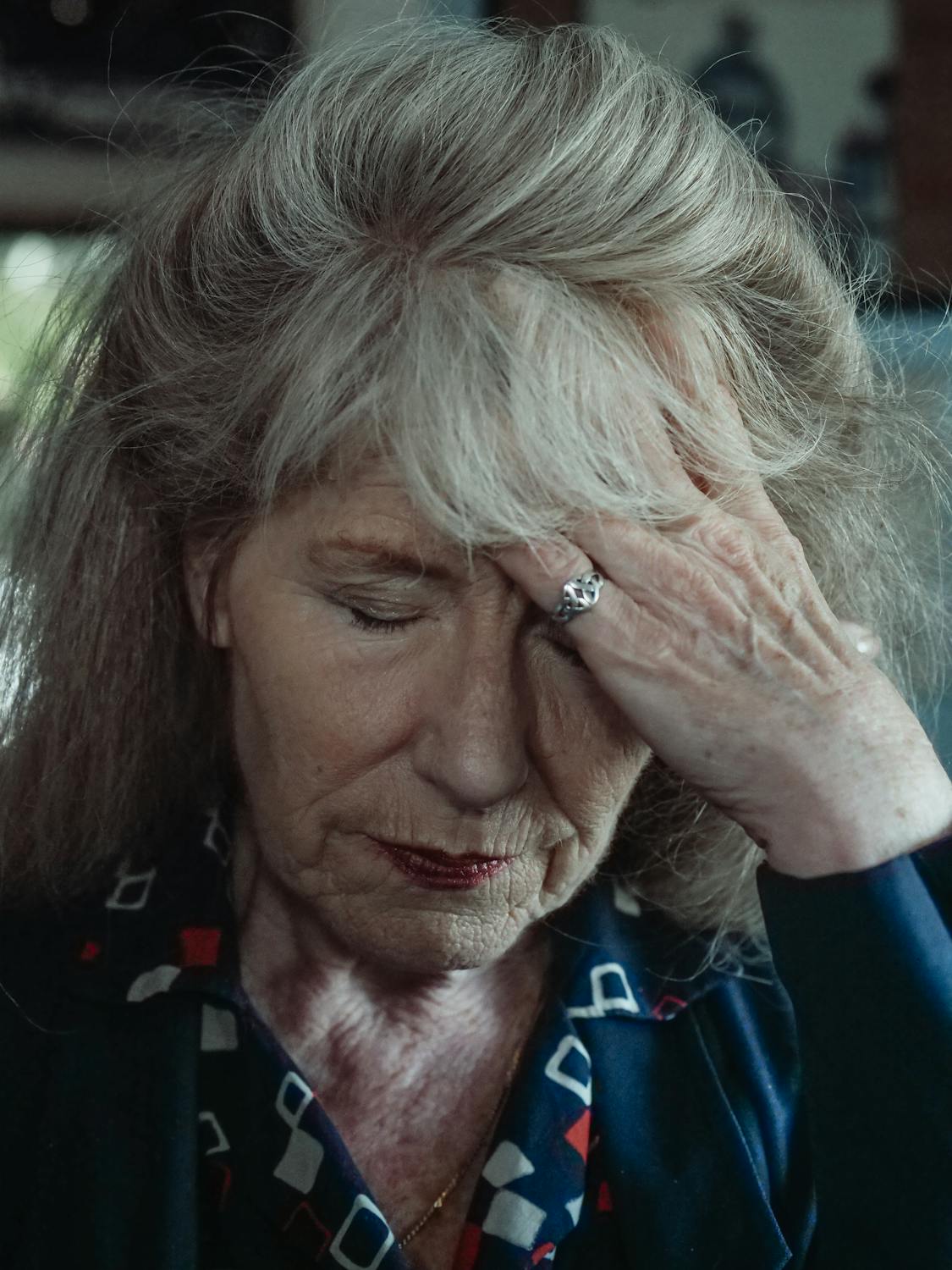 A concerned woman touching her forehead | Source: Pexels